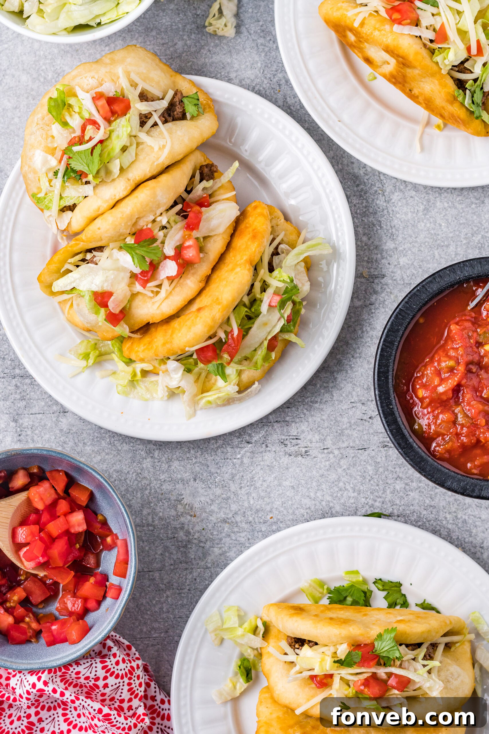 Another appealing overhead view of Taco Bell Chalupas presented on clean white plates, emphasizing the vibrant colors and freshness of the ingredients.