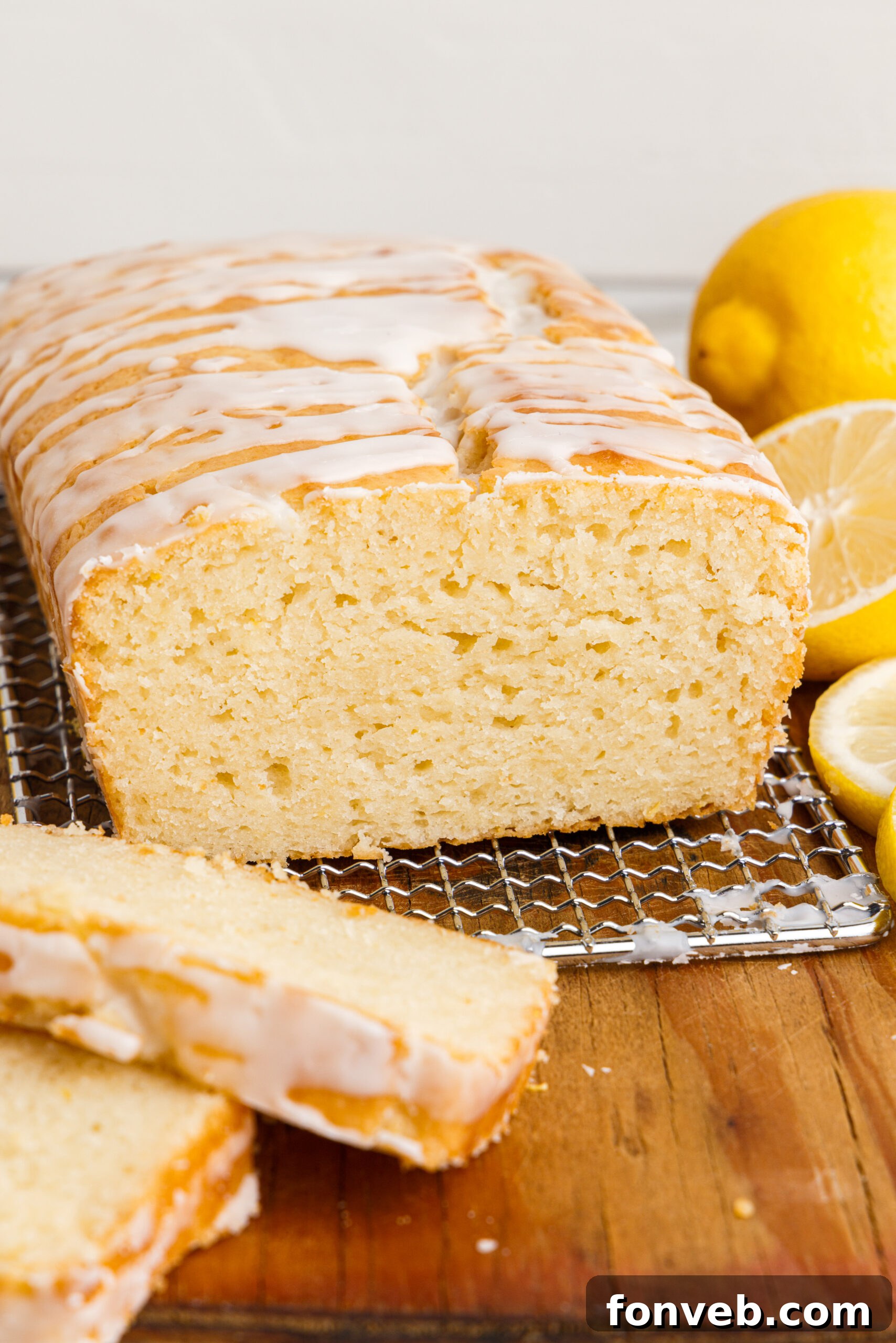 Front view of  Lemon Bread on a wire rack with slices removed.