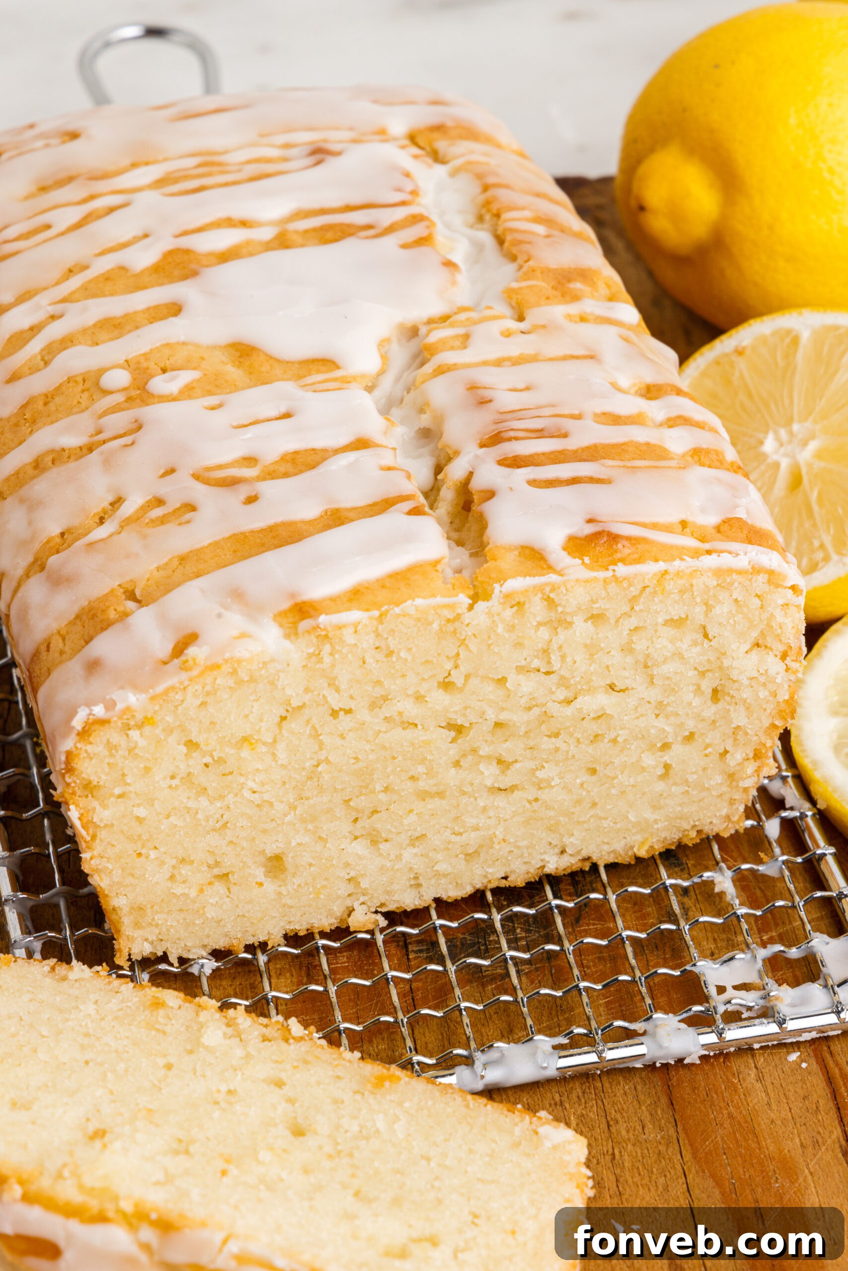 Front view of  Lemon Bread on a wire rack with slices removed.