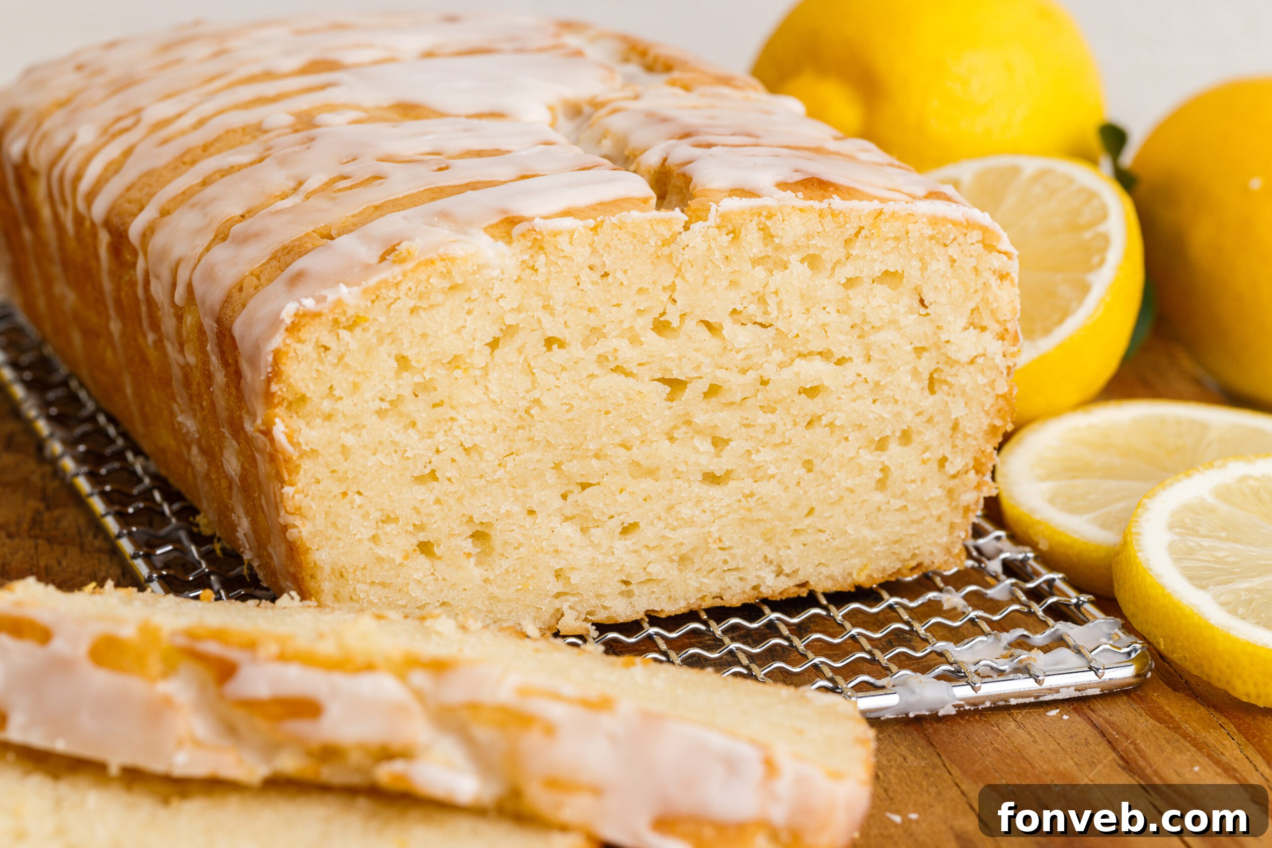 Front view of  Lemon Bread on a wire rack with slices removed.