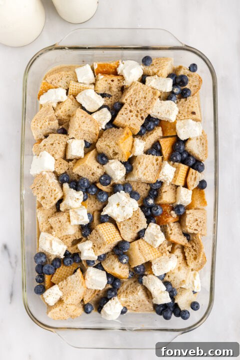 Mixing bowl with eggs, milk, and other liquid ingredients for the custard.