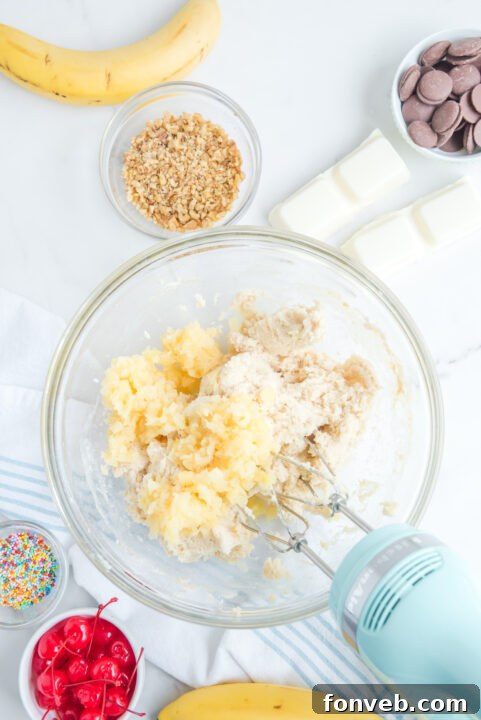 The truffle mixture after the addition of crushed pineapple and banana slices, showing its creamy texture.