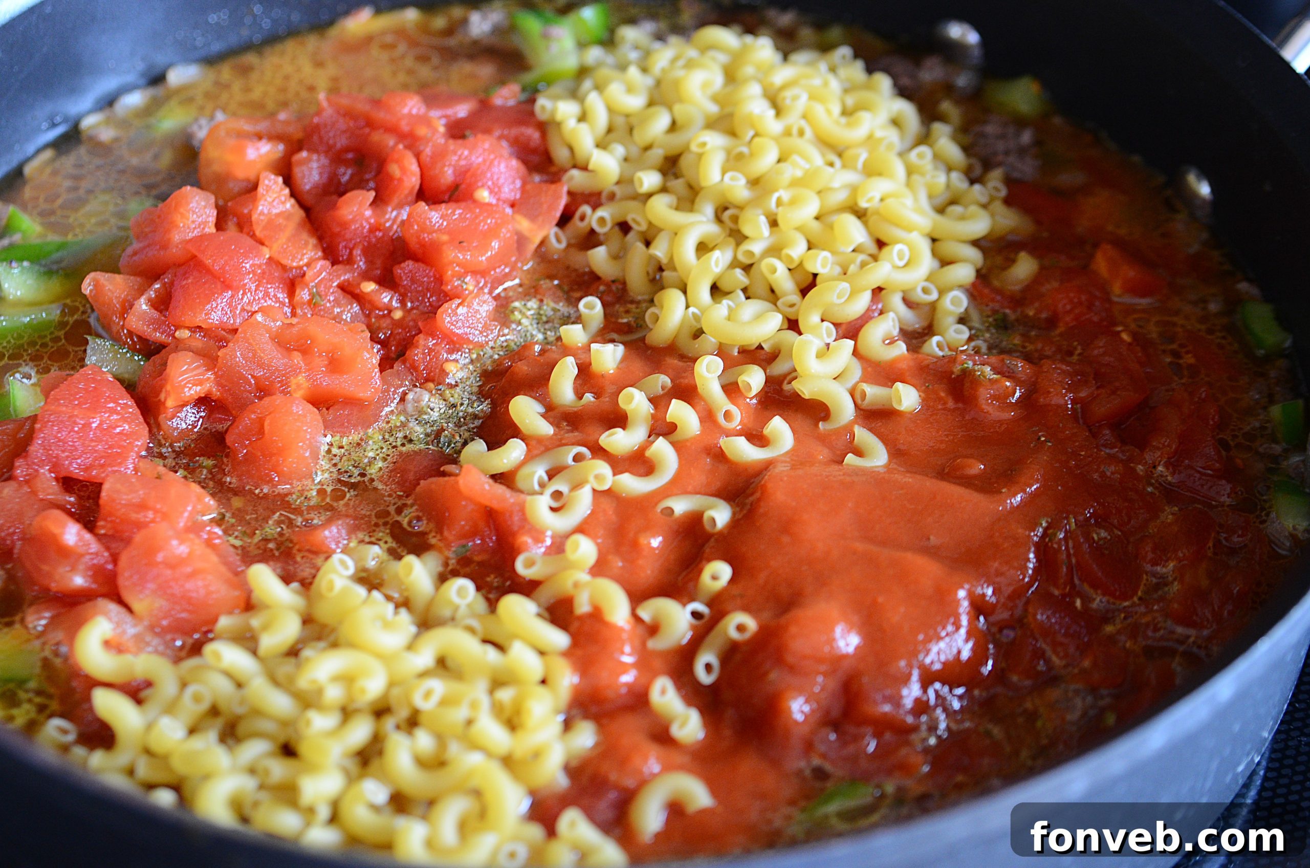 Nana's American Chop Suey 5 Ground beef and vegetables sautéing in a skillet for American Chop Suey