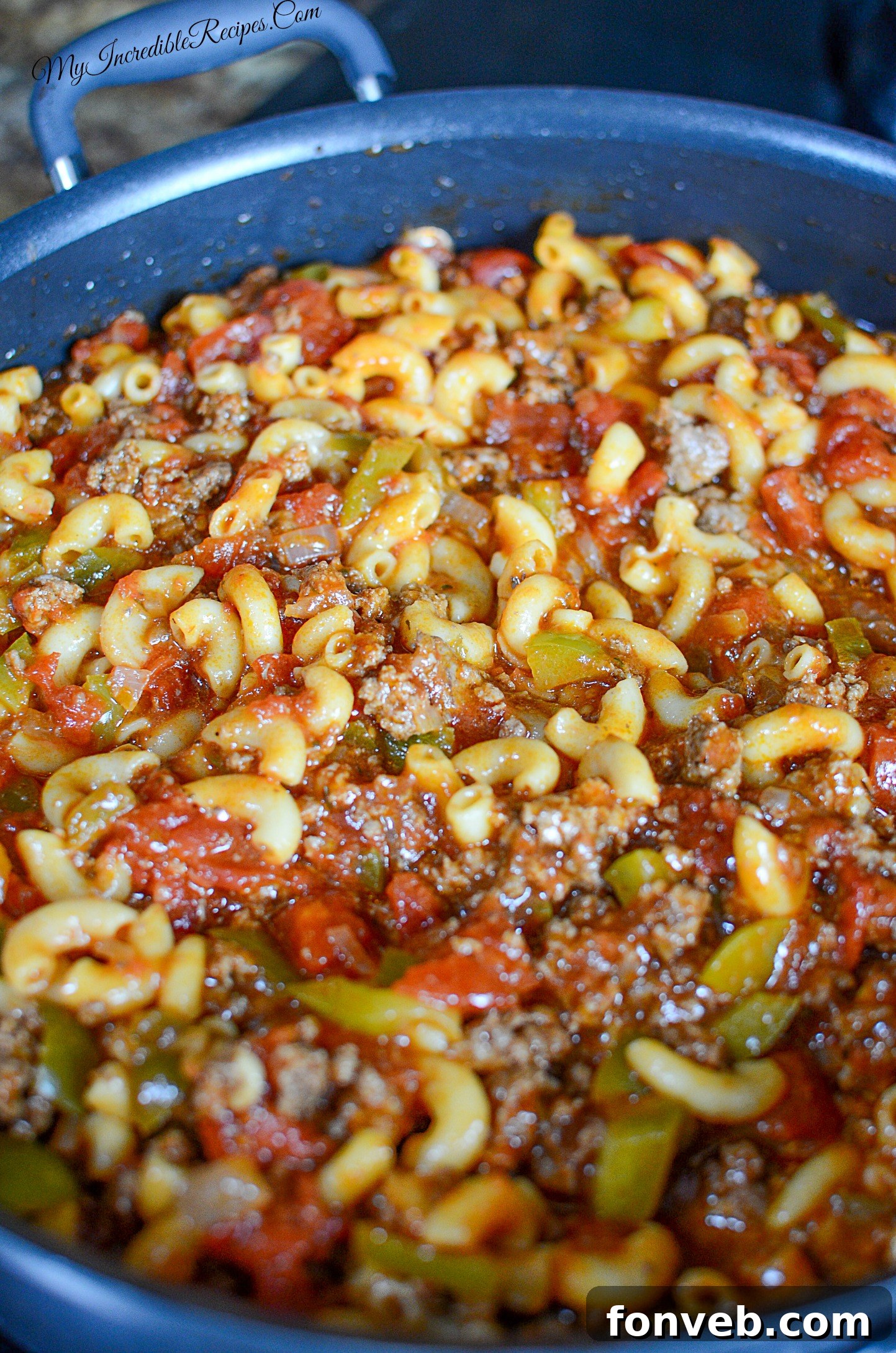 Nana's American Chop Suey 10 Serving spoon lifting American Chop Suey from the pot