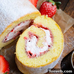A beautifully sliced Strawberries & Cream Cake Roll