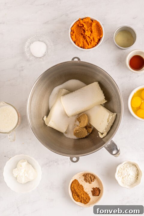 Spiced Fall Cheesecake Bites 11 A top-down view of mini pumpkin cheesecakes, showing off their smooth surface.