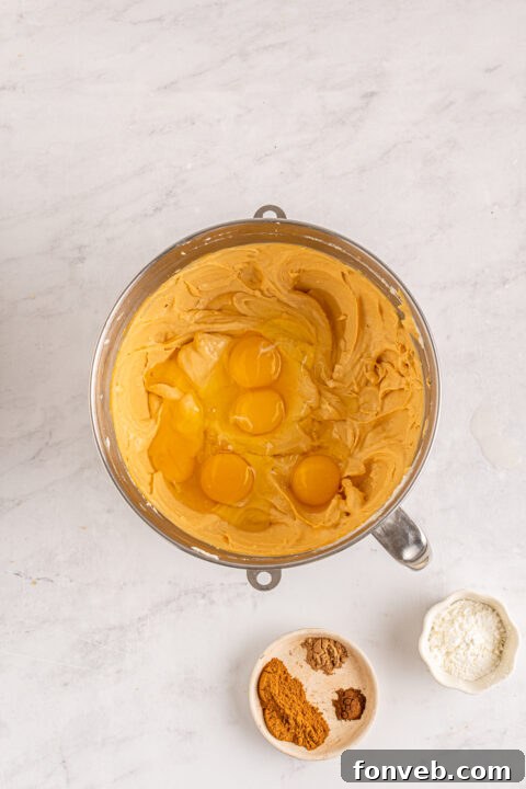 Spiced Fall Cheesecake Bites 13 A single mini pumpkin cheesecake artfully presented.