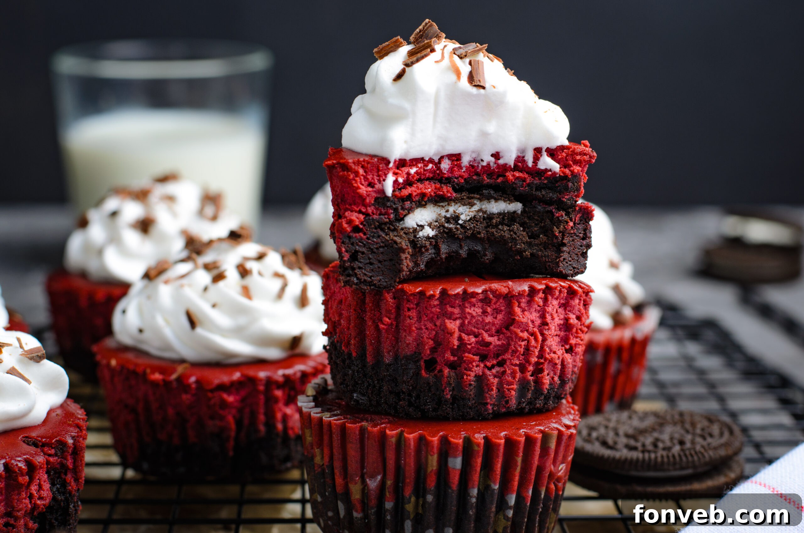 Ruby Red Oreo Cheesecake Gems 2 Close up view of Mini Red Velvet Oreo Cheesecakes stacked with a bite missing from the top one