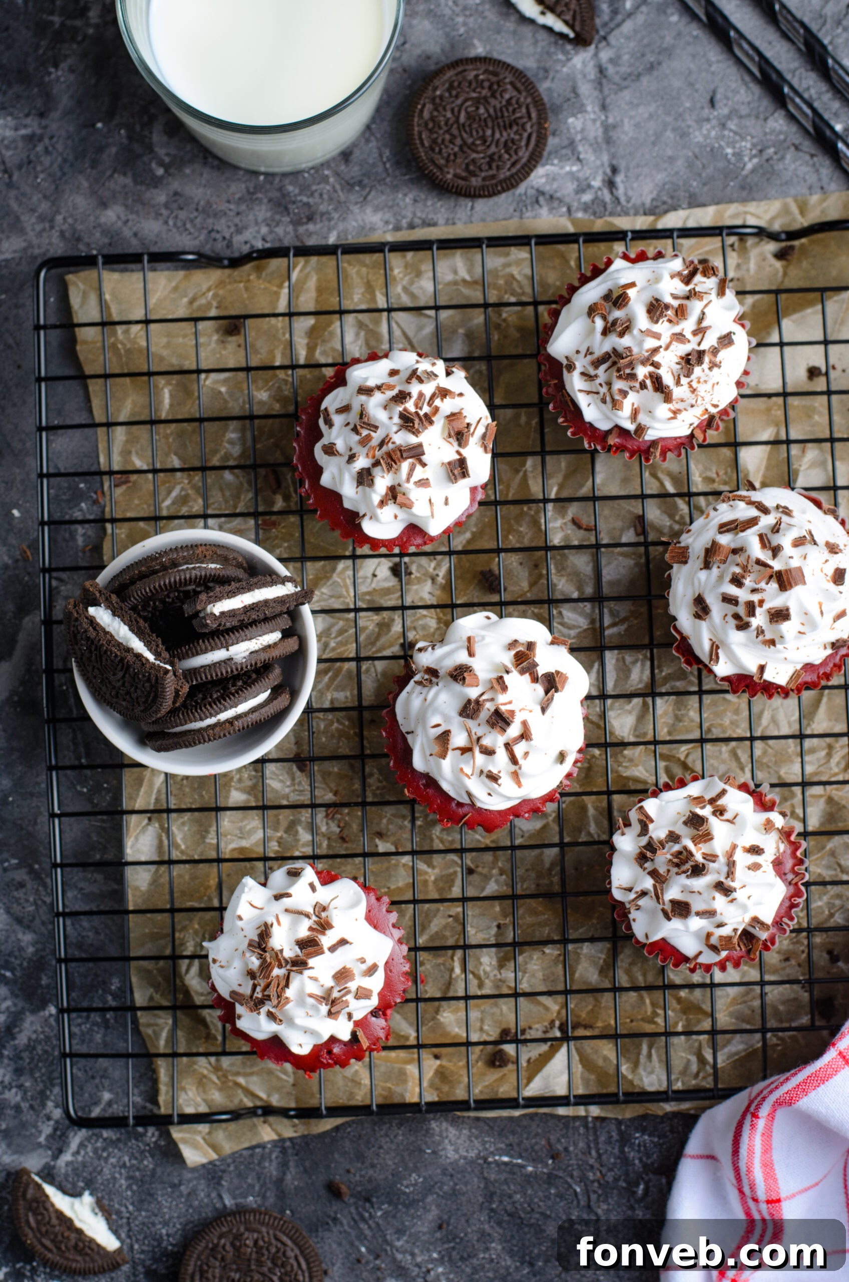 Ruby Red Oreo Cheesecake Gems 6 Overhead view of Mini Red Velvet Oreo Cheesecakes on a black wire rack.