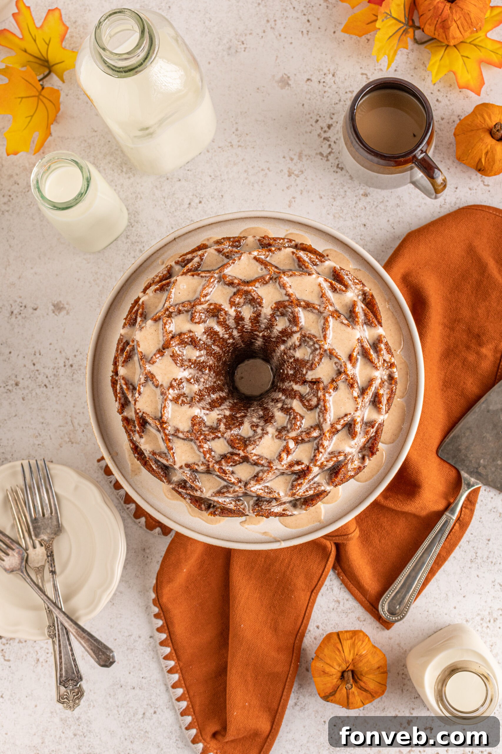 Harvest Pumpkin Bundt with Sweet Cinnamon Finish 3 Overhead view of a beautifully decorated Pumpkin Bundt Cake with Cinnamon Sugar Glaze, ready to be served.