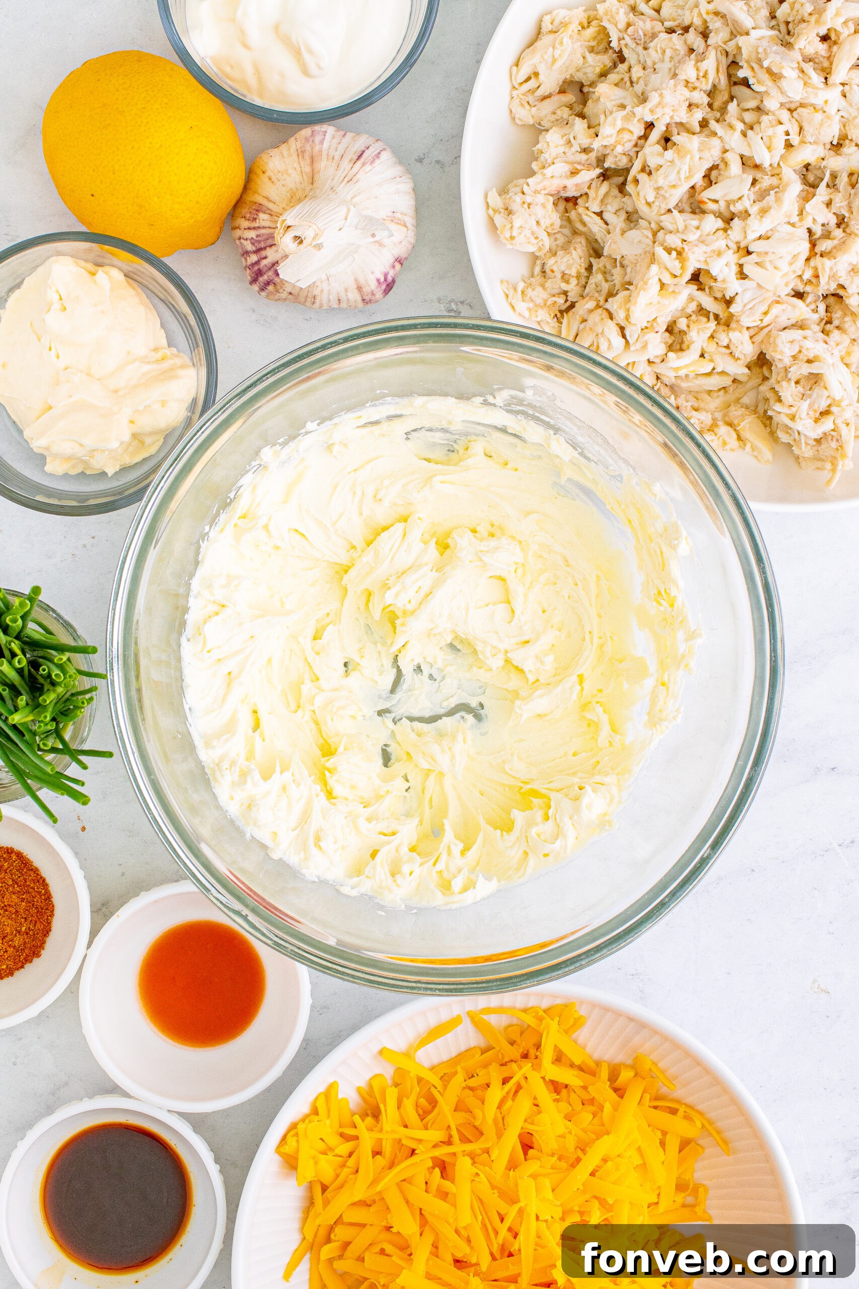 Overhead view showcasing all the fresh ingredients meticulously arranged, ready to be combined for this delightful crab dip recipe.