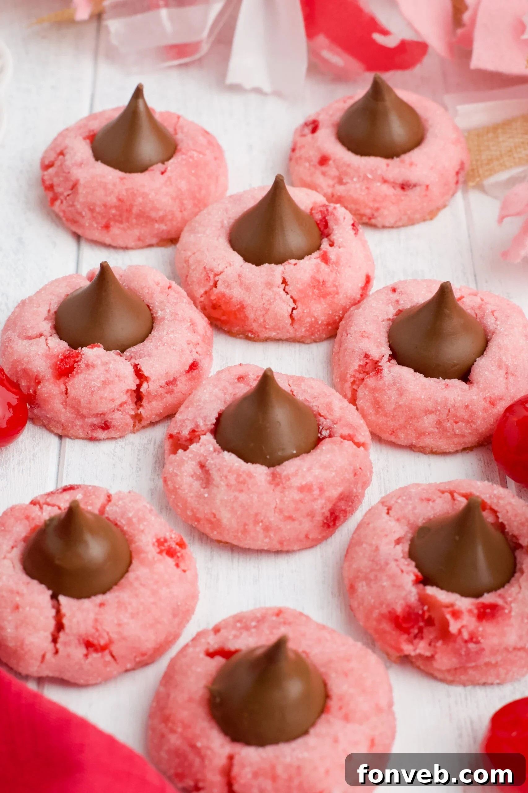 Front view of a single Cherry Blossom Cookie with a bite taken out, showing the soft interior.