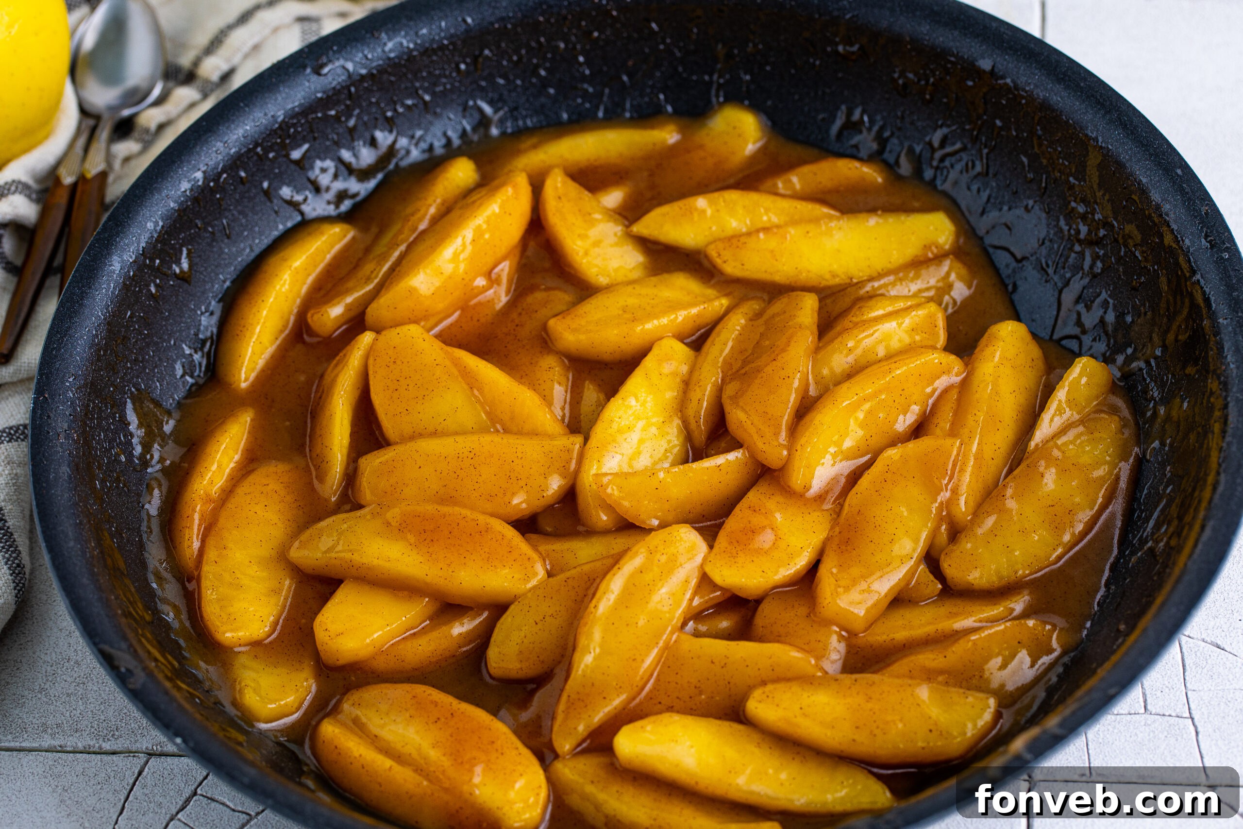 Overhead view of Cracker Barrel Fried Apples in a black dish, beautifully presented.