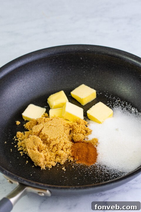 Freshly sliced Golden Delicious apples, peeled and ready for cooking.
