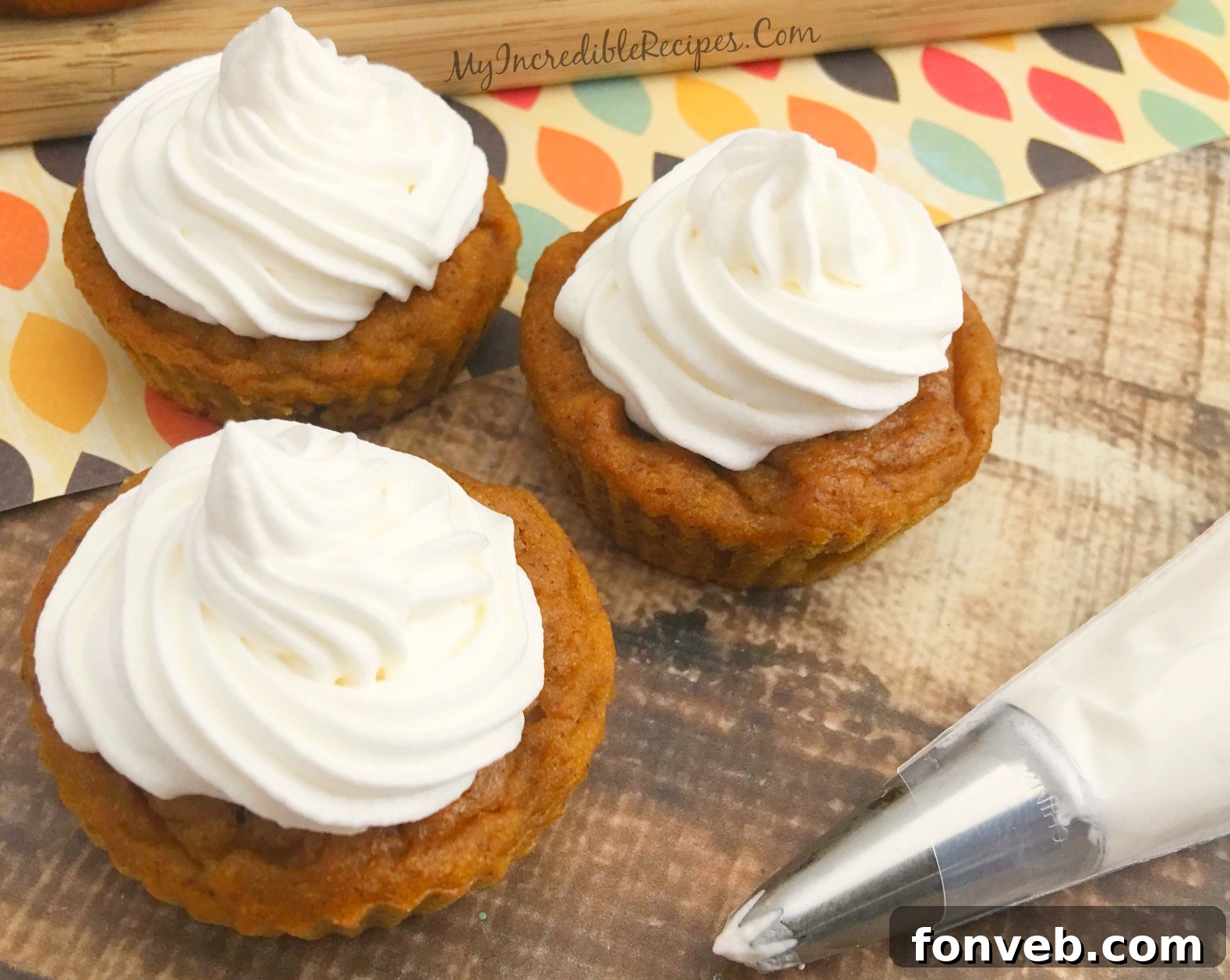 Decorated Pumpkin Pie Cupcakes with whipped topping