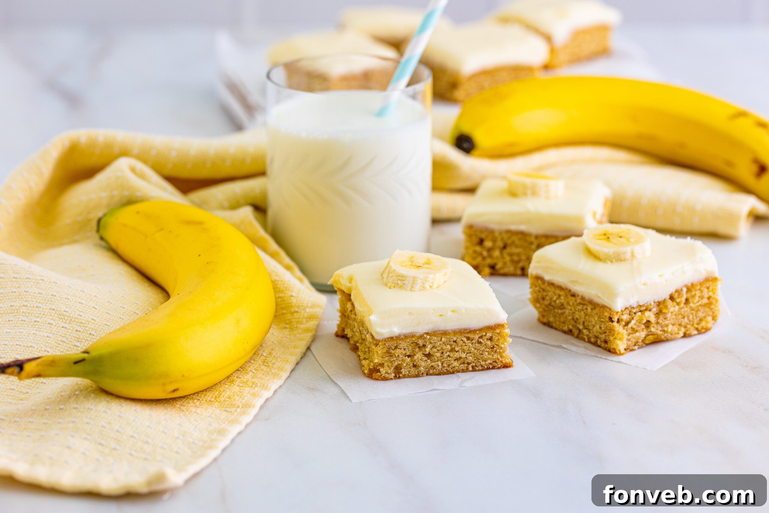 Front view of freshly baked Banana Brownies cooling on parchment paper, ready to be frosted.