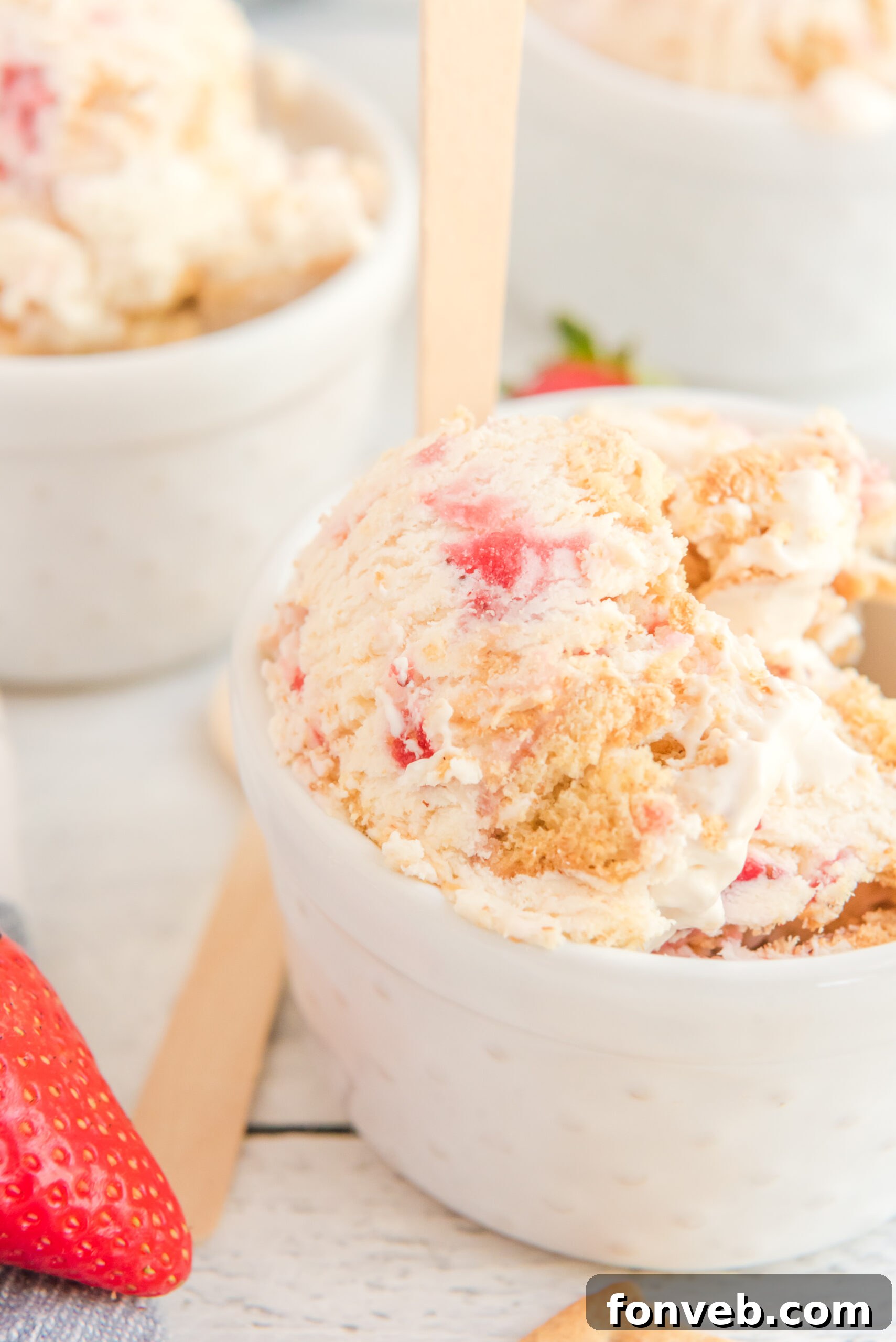 Frozen Strawberry Cheesecake Dream 5 white bowl filled with Strawberry Cheesecake Ice Cream.