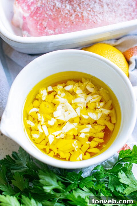 Raw pork chops seasoned with salt and pepper in a baking dish.