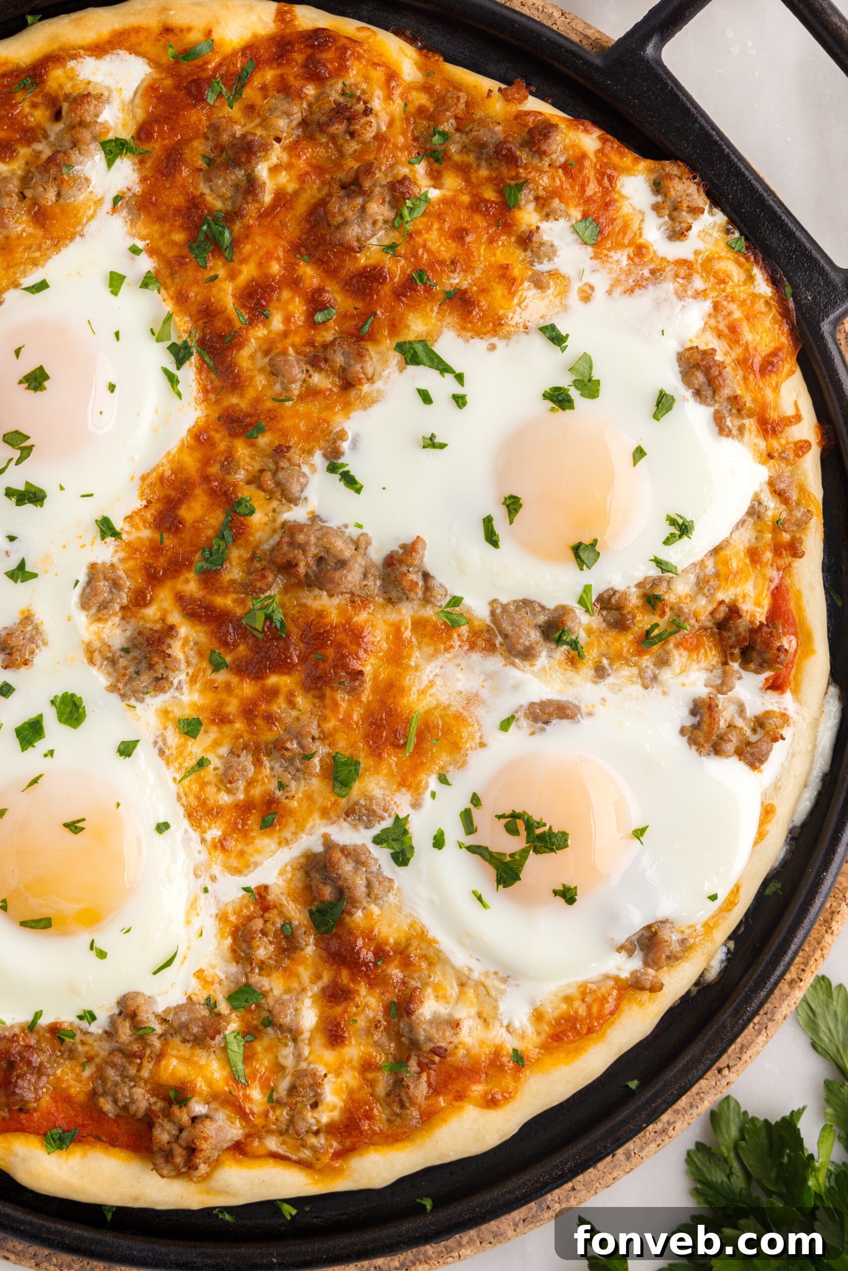 Artfully arranged fresh ingredients for a homemade Breakfast Pizza on a rustic wooden board, ready for assembly.