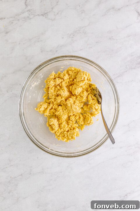 Pre-baked cobbler with the biscuit topping in place, brushed with buttermilk and sprinkled with decorator's sugar.