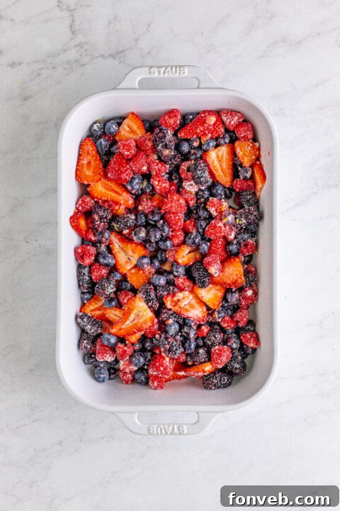 More preparation steps, focusing on the texture of the berry filling and the process of making the biscuit topping.