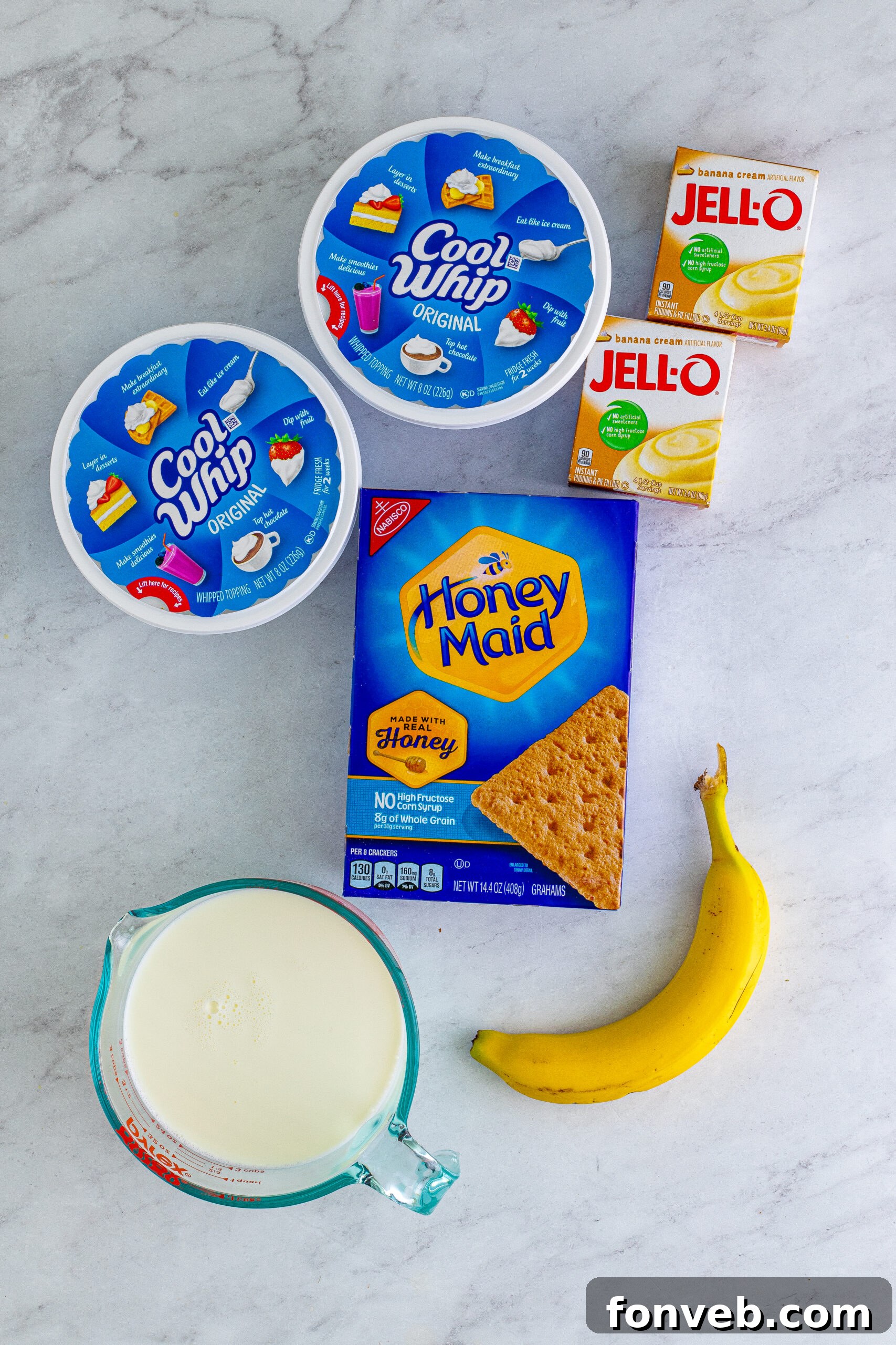 An overhead shot showcasing all the fresh, high-quality ingredients needed to create this delightful Banana Icebox Cake recipe.