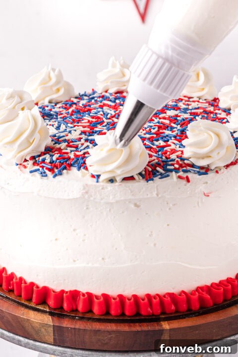 Two separate cake layers, one red and one blue, chilling in the refrigerator.