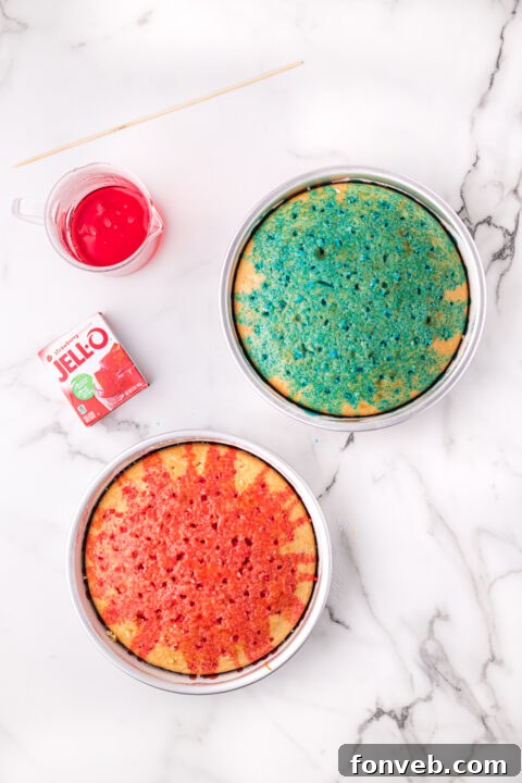 A fork being used to poke holes into the surface of a cooled cake layer.