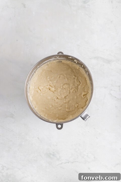 Tropical Coconut Dream Cake 12 Baked cake layers cooling on a wire rack after being removed from the oven.