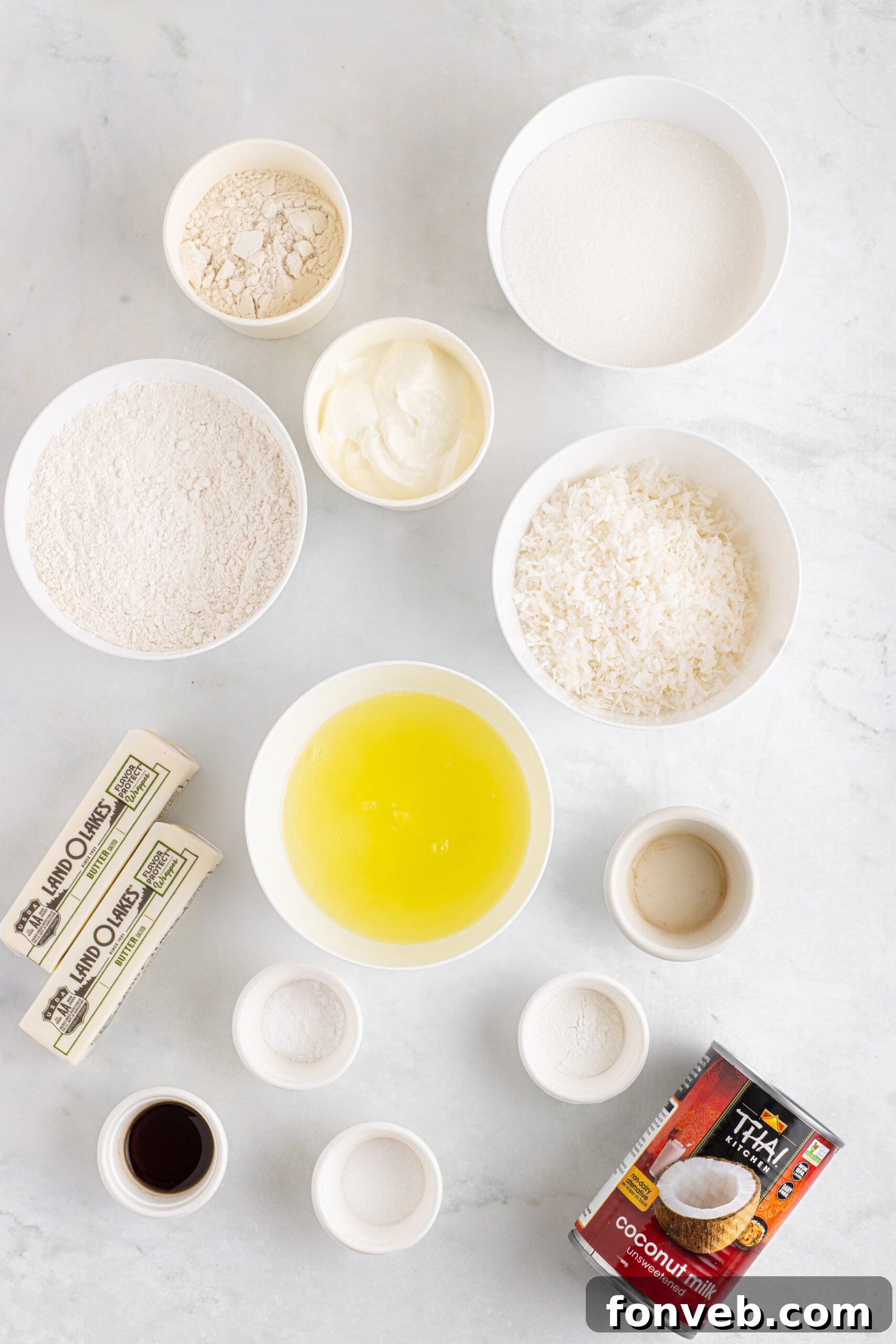 Tropical Coconut Dream Cake 5 An overhead shot displaying all the fresh, high-quality ingredients laid out meticulously, ready for baking this delicious Coconut Layer Cake.