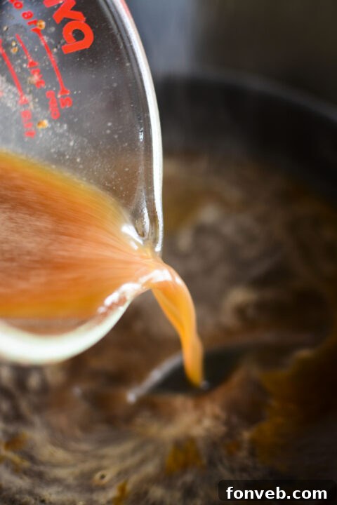 Step-by-step image of caramelized onions being added to the skillet.