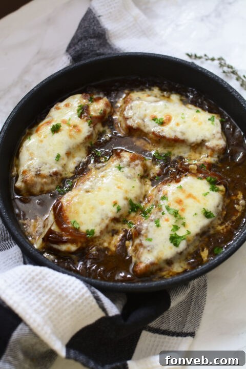 Step-by-step image of finished French Onion Pork Chops in a skillet.