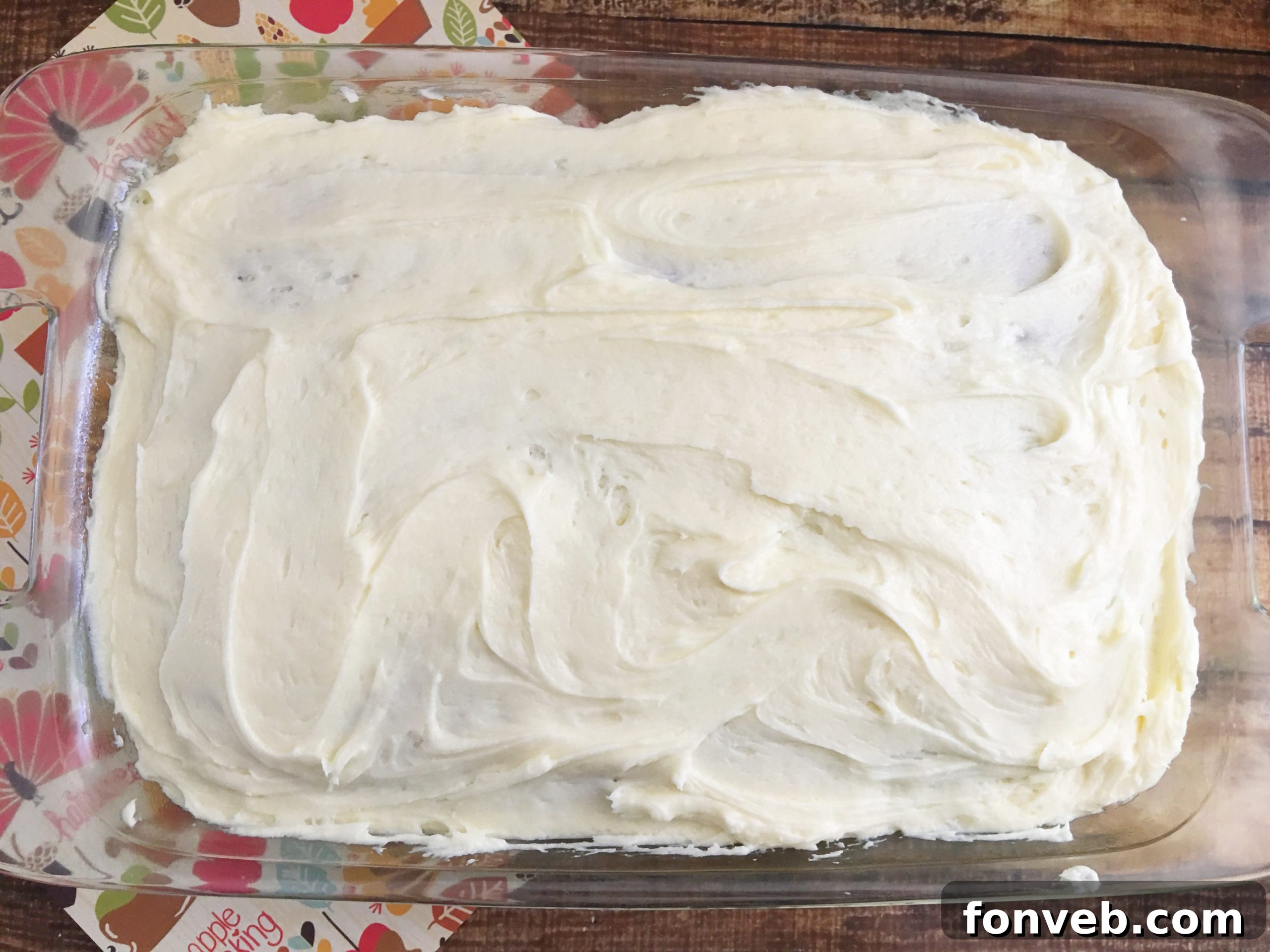 Luscious Pumpkin Spice Cake with Velvety Cream Cheese Frosting 4 Pumpkin cake square on a plate, ready to be served