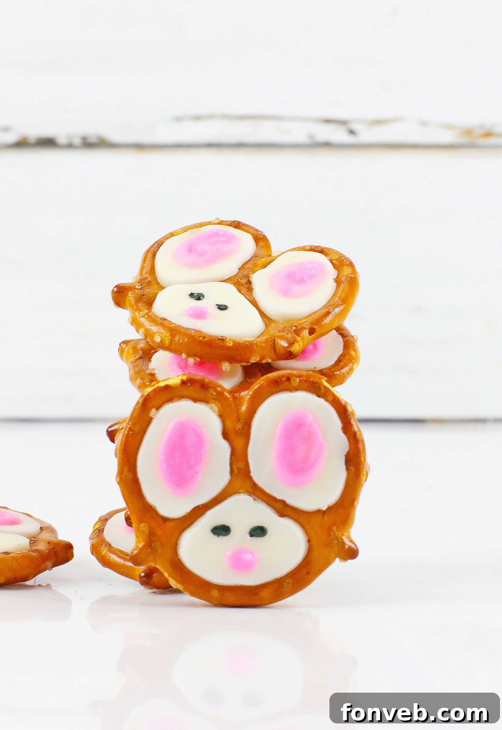 Hoppy Twists 14 A whimsical arrangement of Bunny Pretzels, stacked artfully with one placed playfully in front, suggesting readiness for a festive occasion.