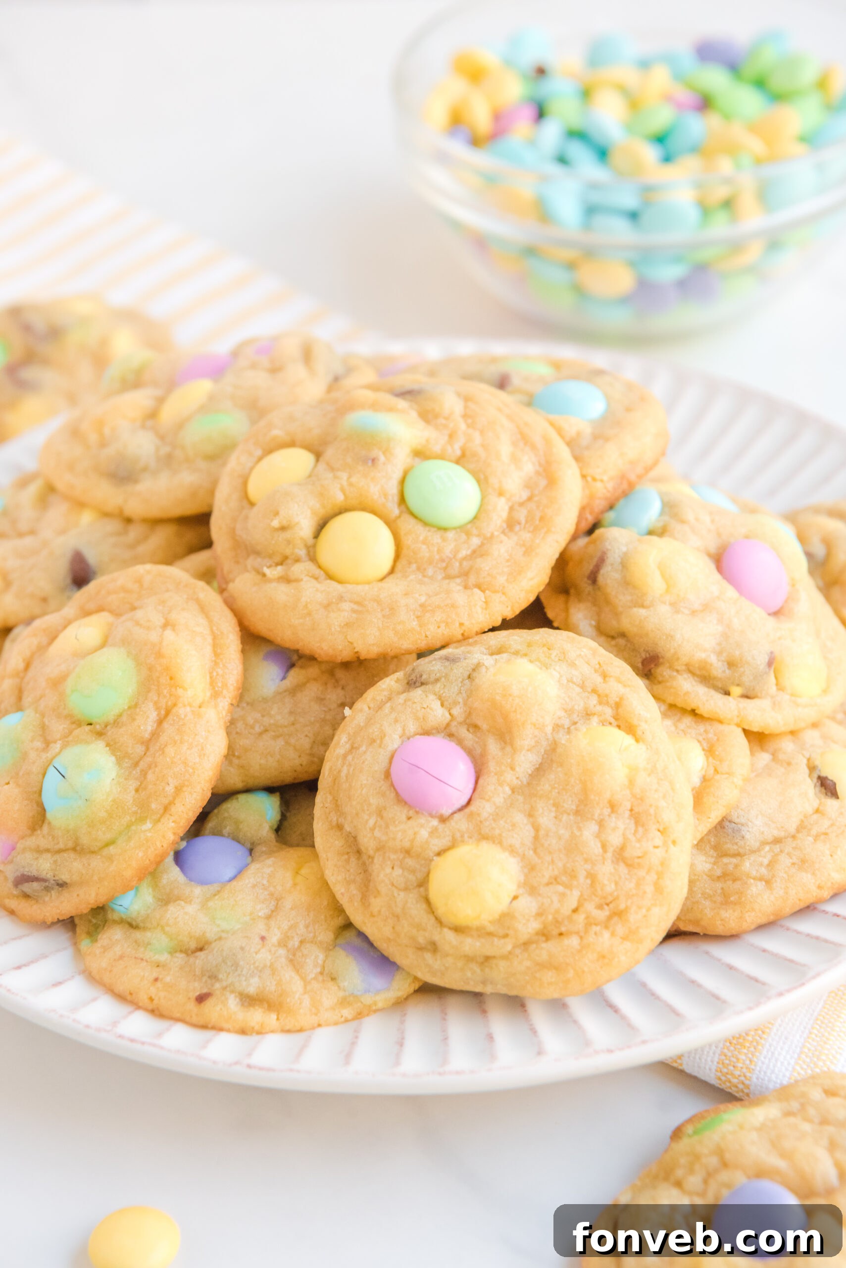 Front view of a beautiful stack of Easter Pudding Cookies on a white plate, ready to be enjoyed.