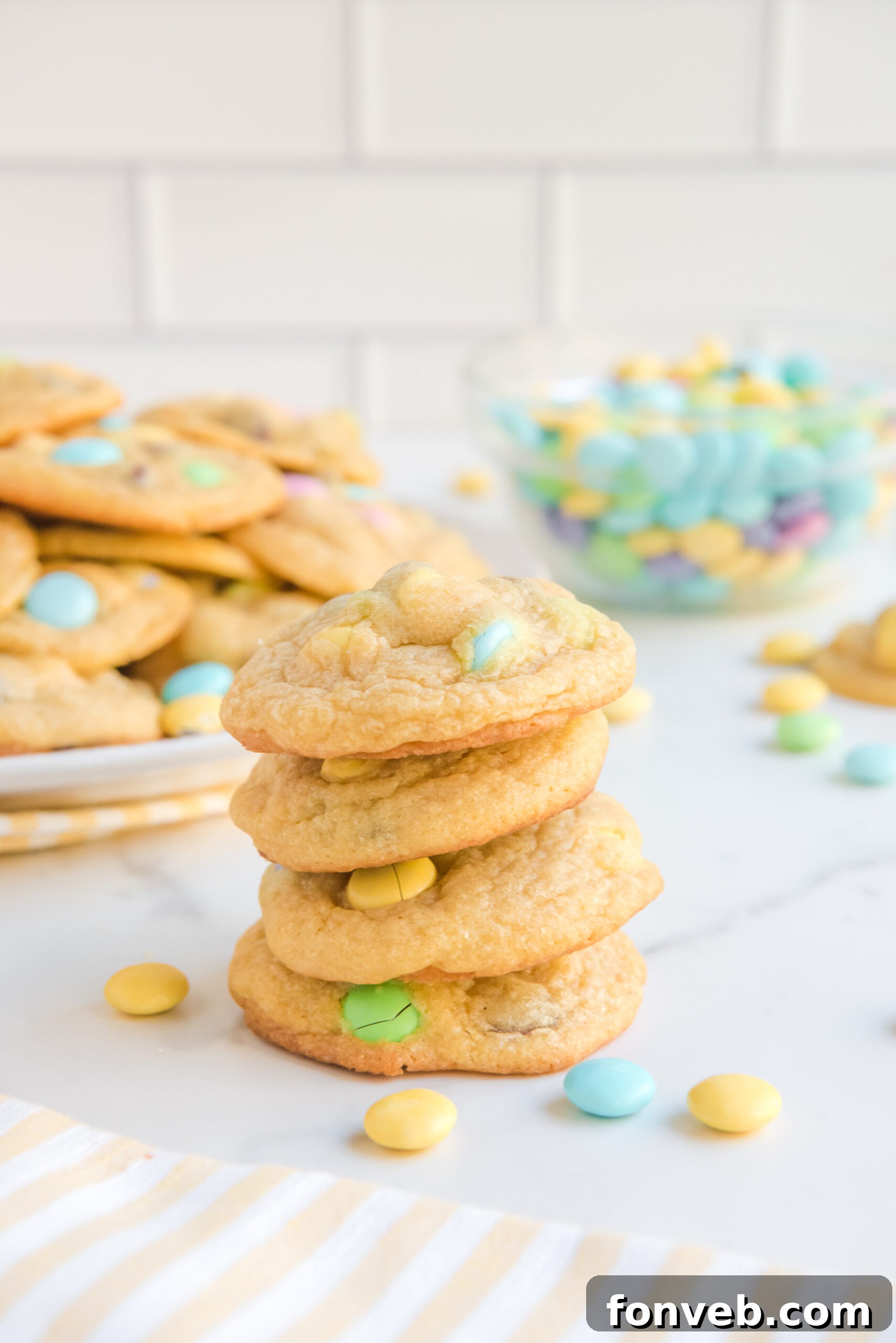 Front view of four perfectly stacked Easter Pudding Cookies, showing off their soft centers.