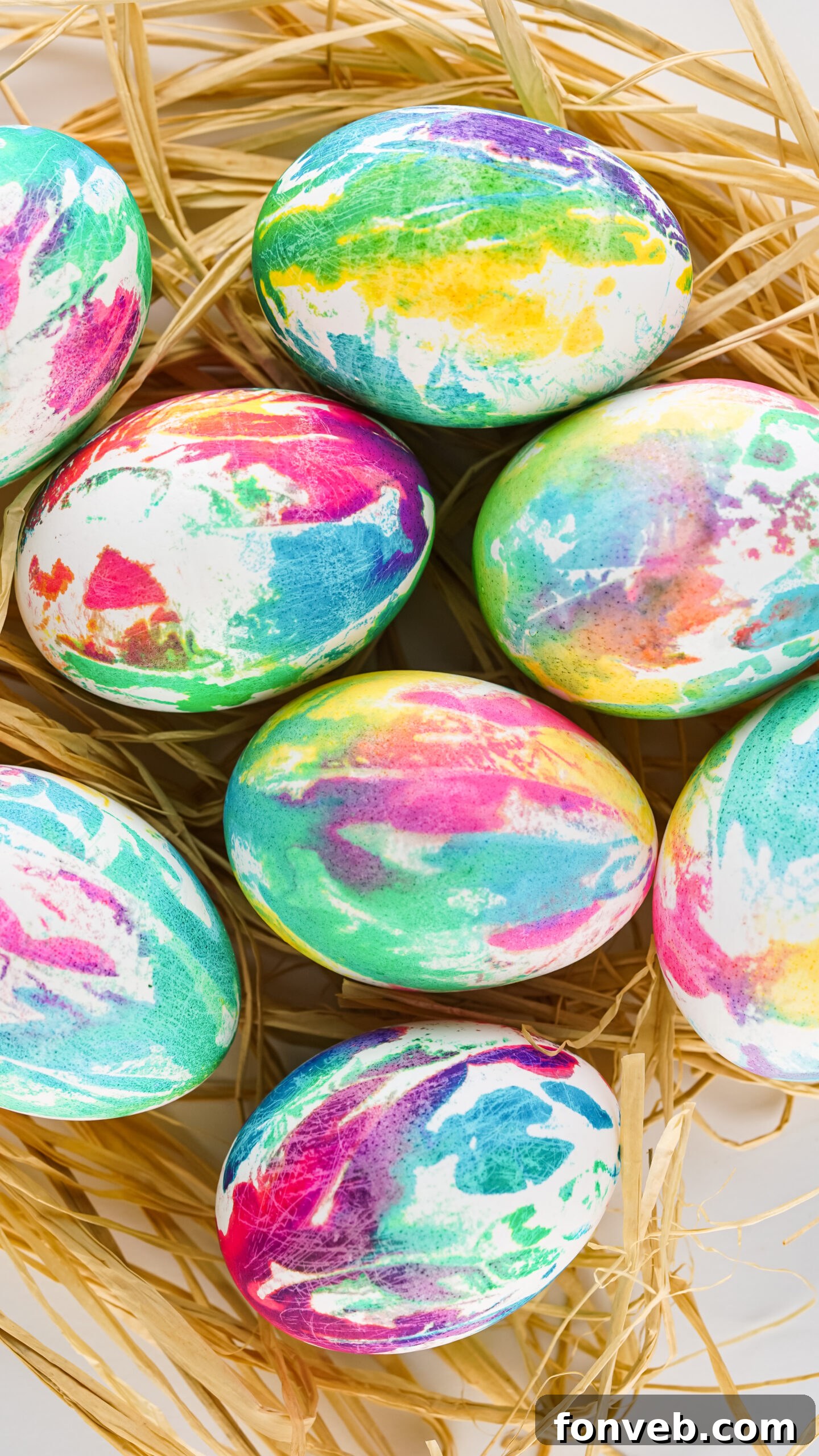 Overhead view of Tie Dye Easter Eggs on a bed of Easter grass.