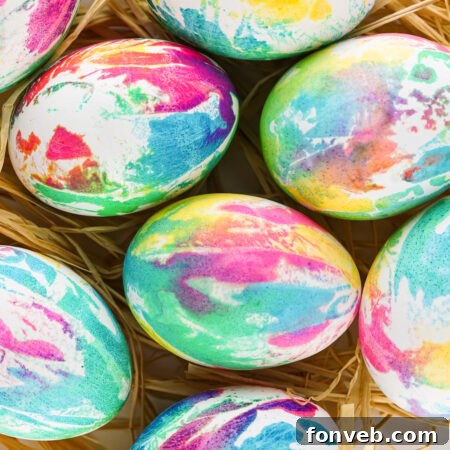 Close up view of Tie Dye Easter Eggs in a brown basket.