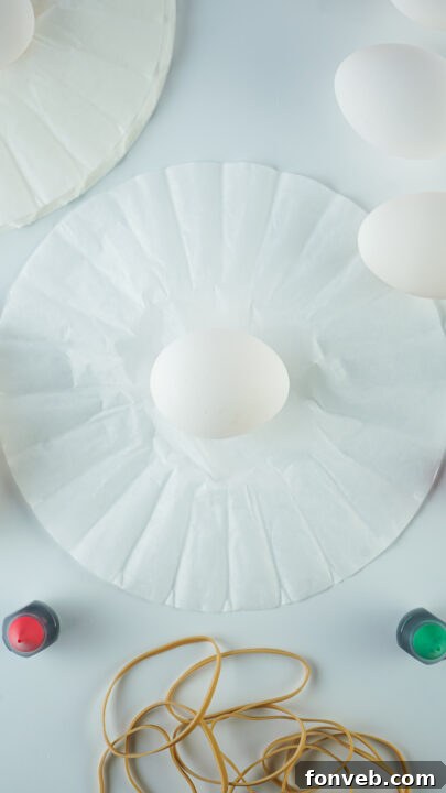 Wrapping an egg in a coffee filter and securing with a rubber band.