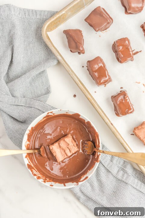 Sweet Cloud Candies 15 A baking sheet filled with perfectly coated Cool Whip Candy bars, ready for drizzling.