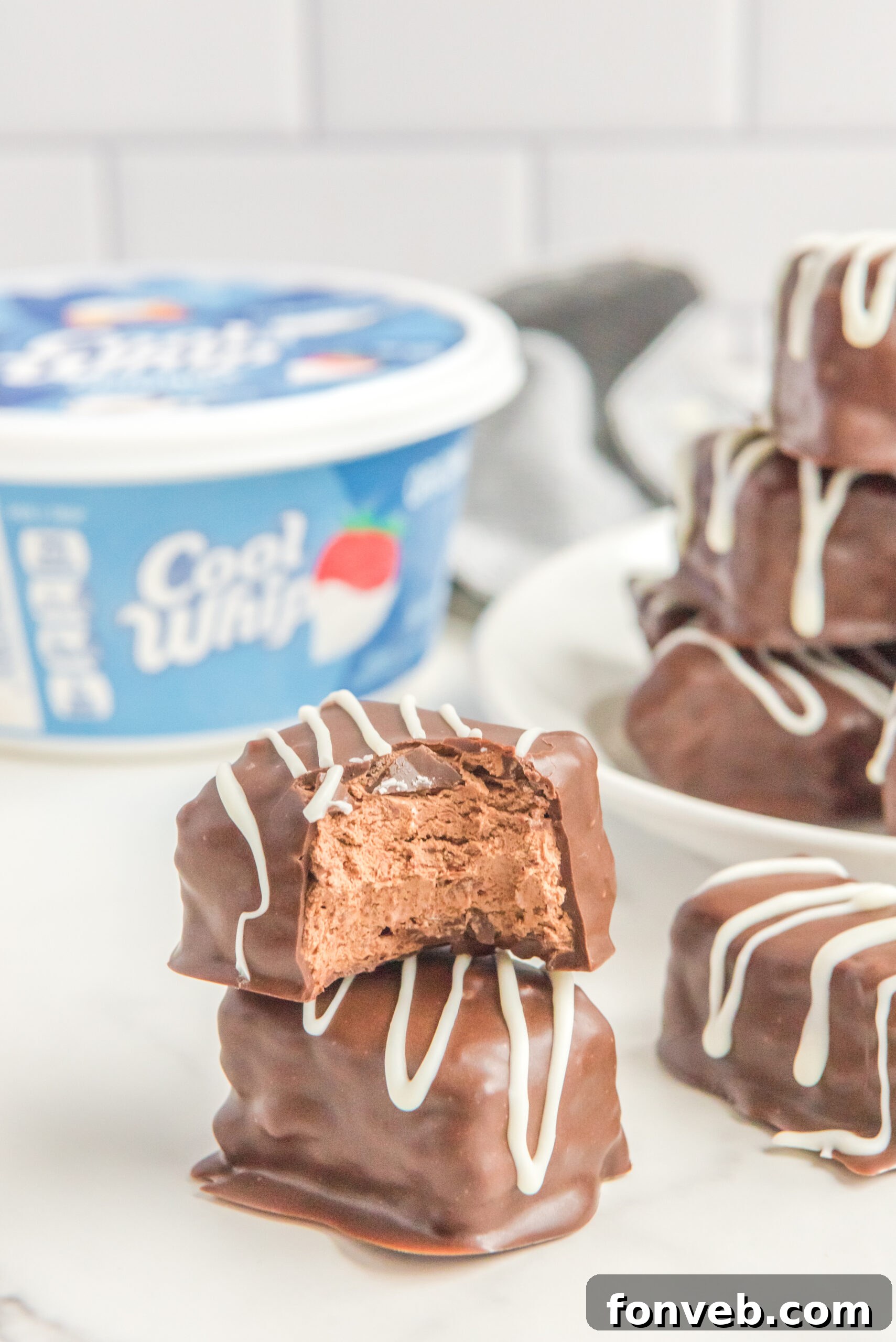 Sweet Cloud Candies 19 A close-up of a Cool Whip Candy bar with a bite taken out, revealing its fluffy, creamy center.