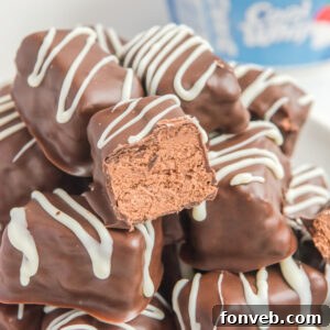 a big stack of Cool Whip Candy with a bite taken out of the top one