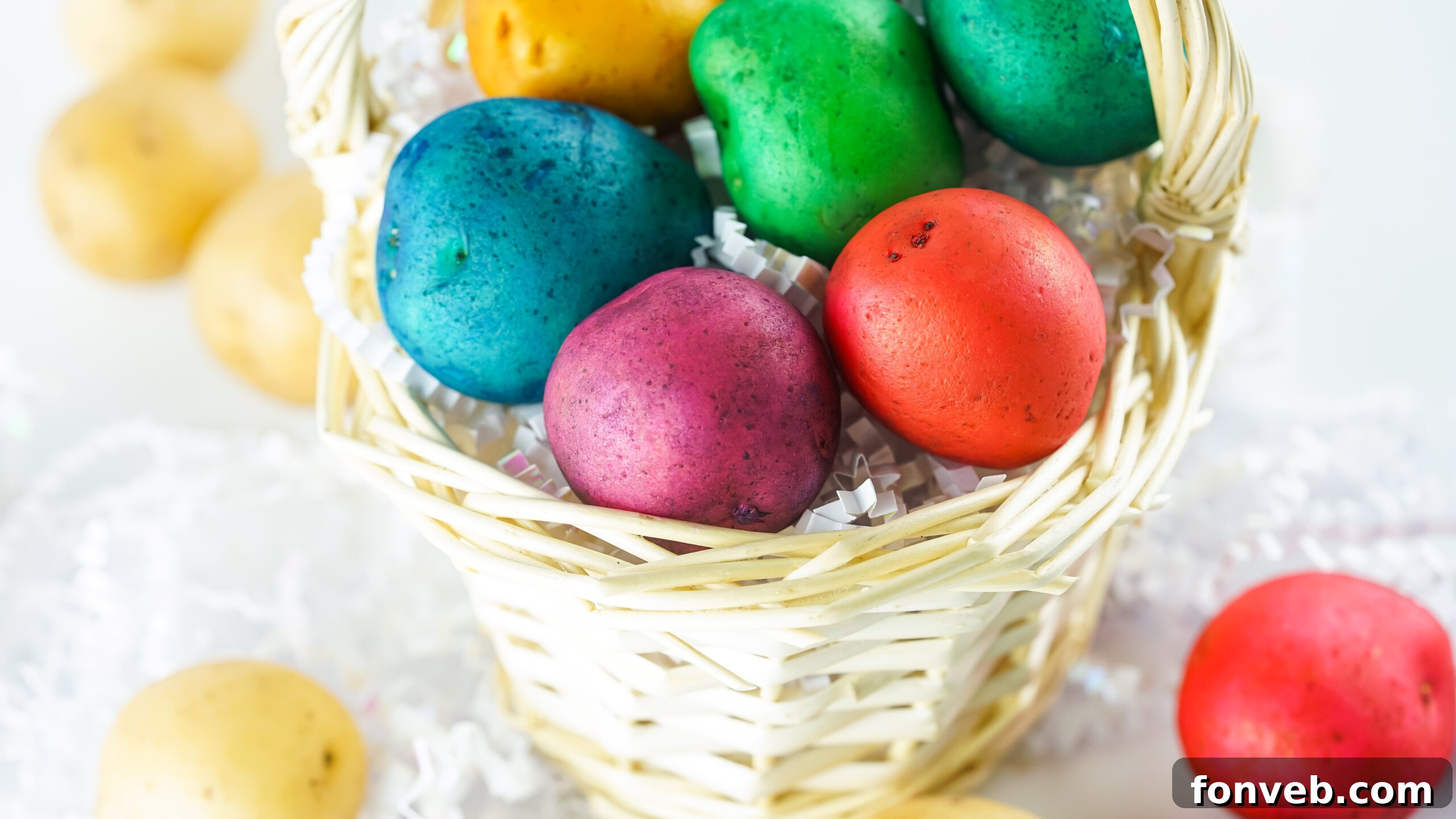 Another view of the beautifully Dyed Easter Egg Potatoes arranged artistically in a tan basket, perfect for Easter decor.