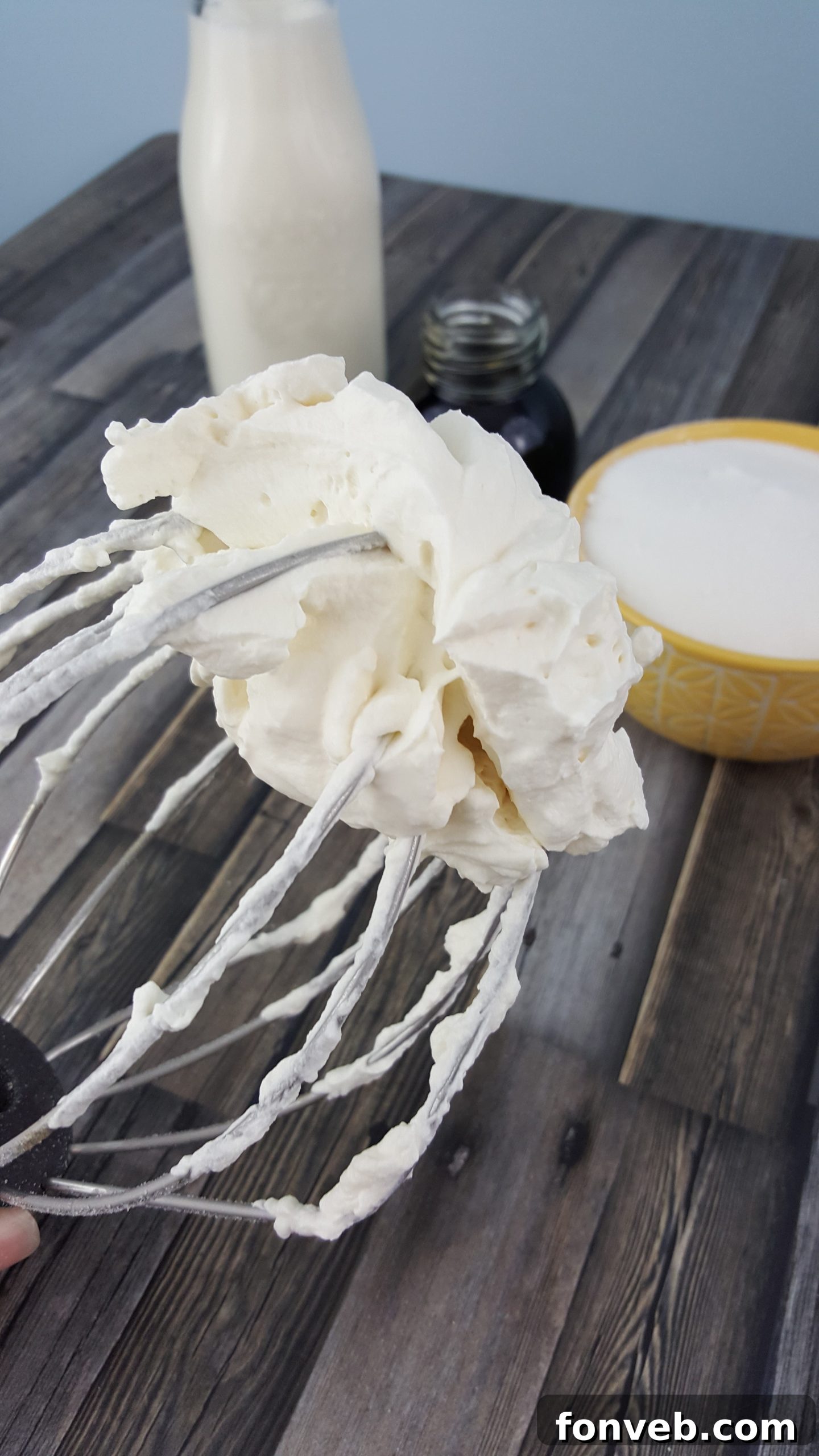 Freshly baked Kahlúa White Russian cupcakes on a cooling rack