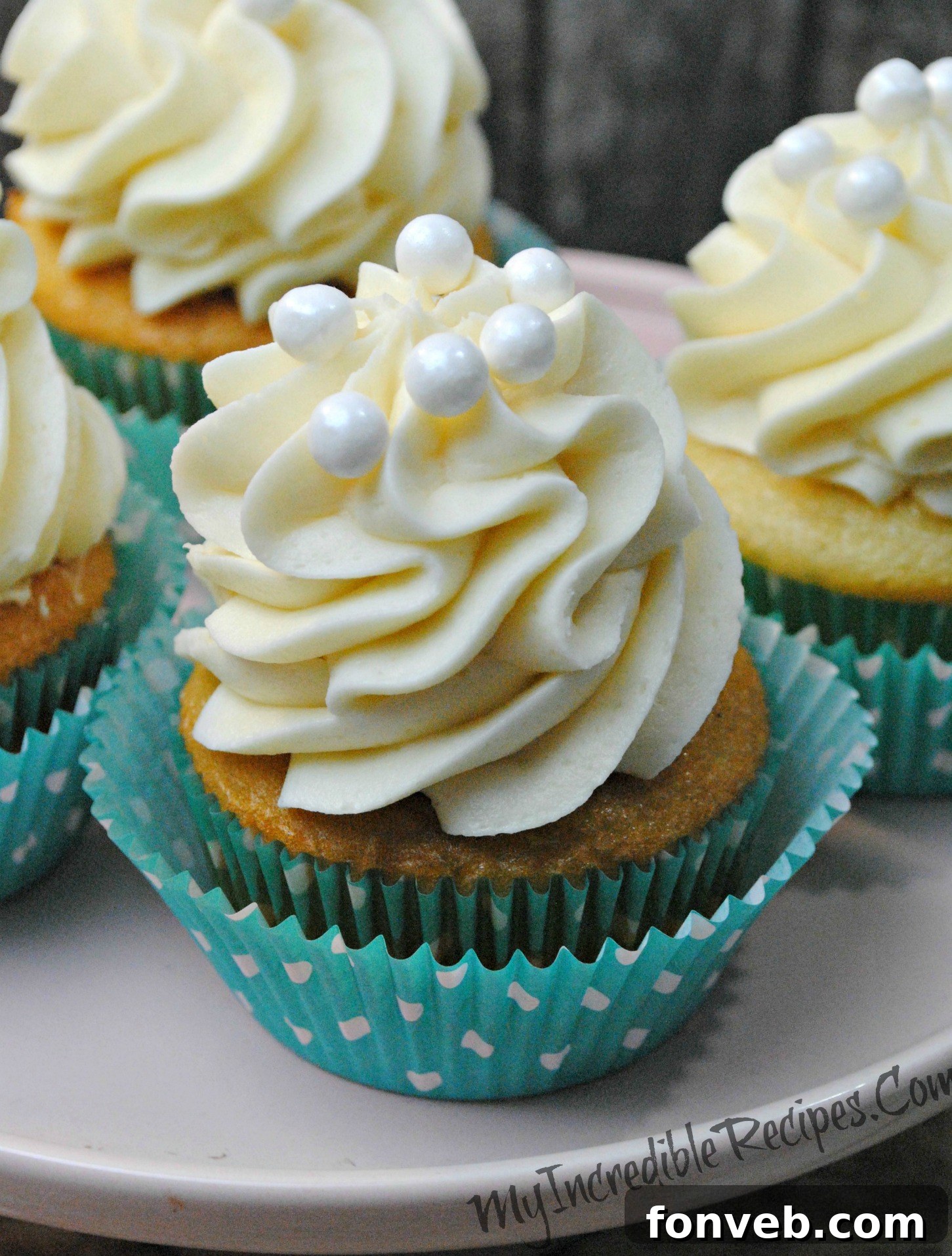 Close-up of a perfectly frosted Kahlúa White Russian cupcake