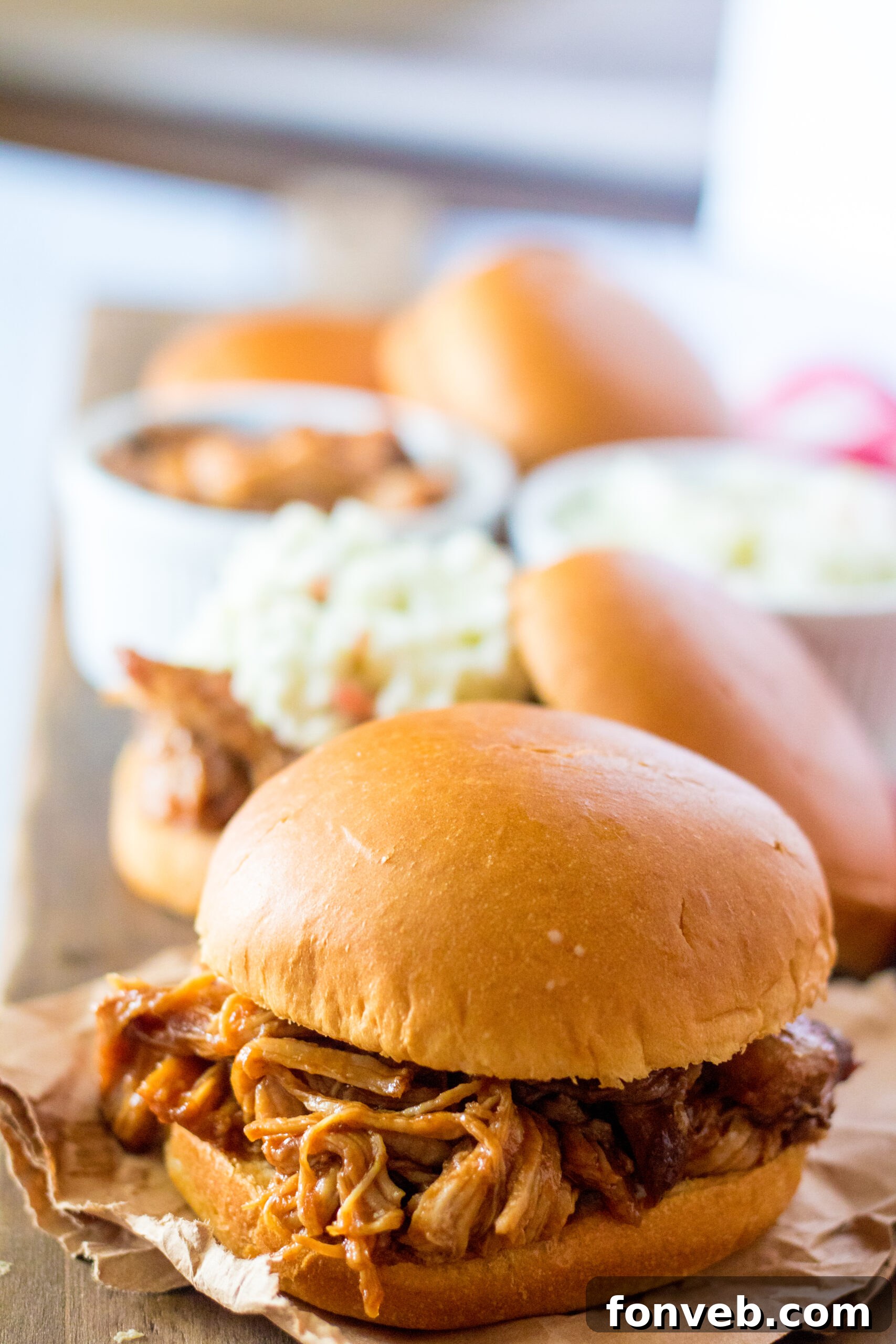 Sticky Sweet Slow Cooker Coke Pulled Pork 11 Front view of Slow Cooker Cola Pulled Pork on a bun.