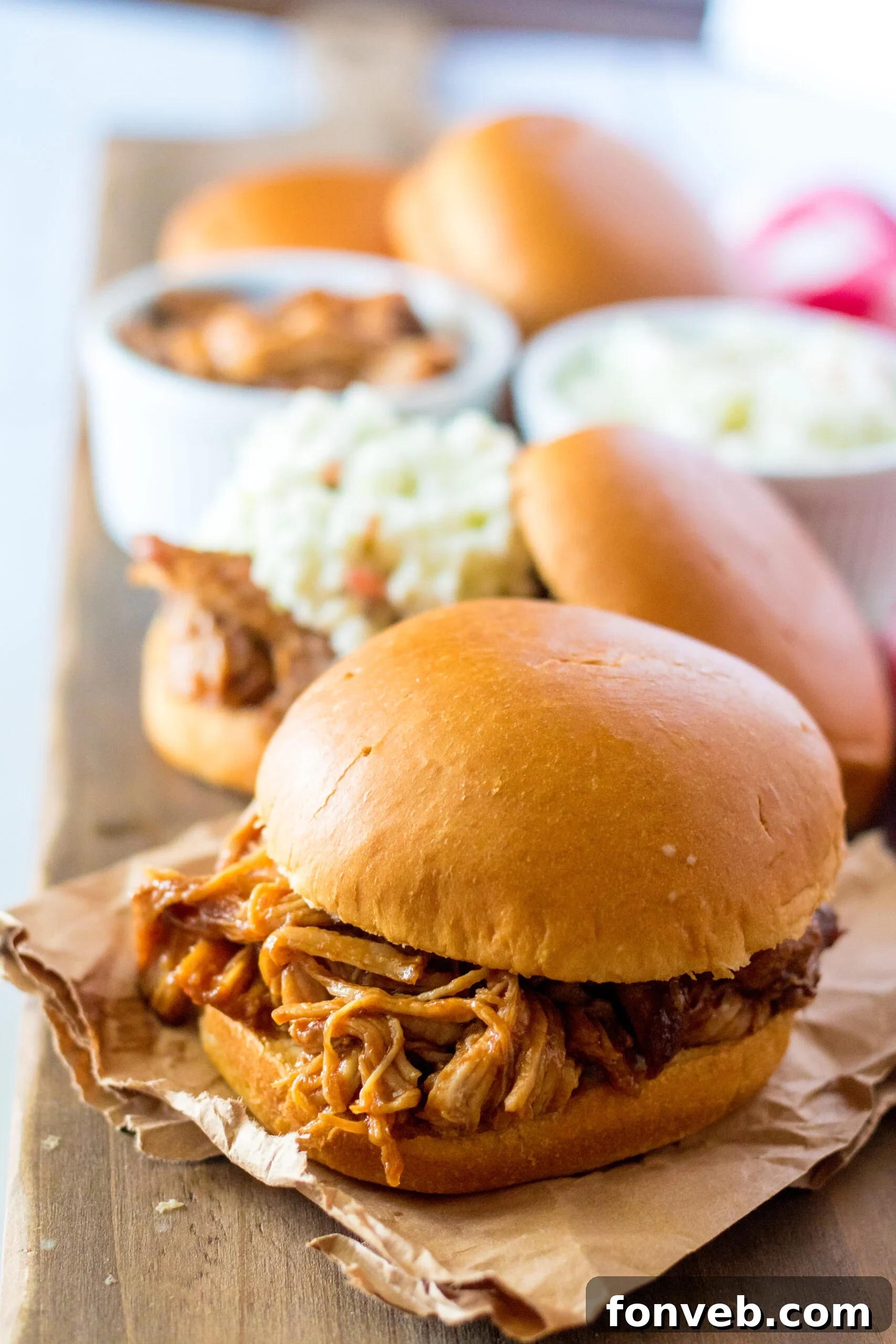 Sticky Sweet Slow Cooker Coke Pulled Pork 10 Front view of Slow Cooker Cola Pulled Pork on a bun.