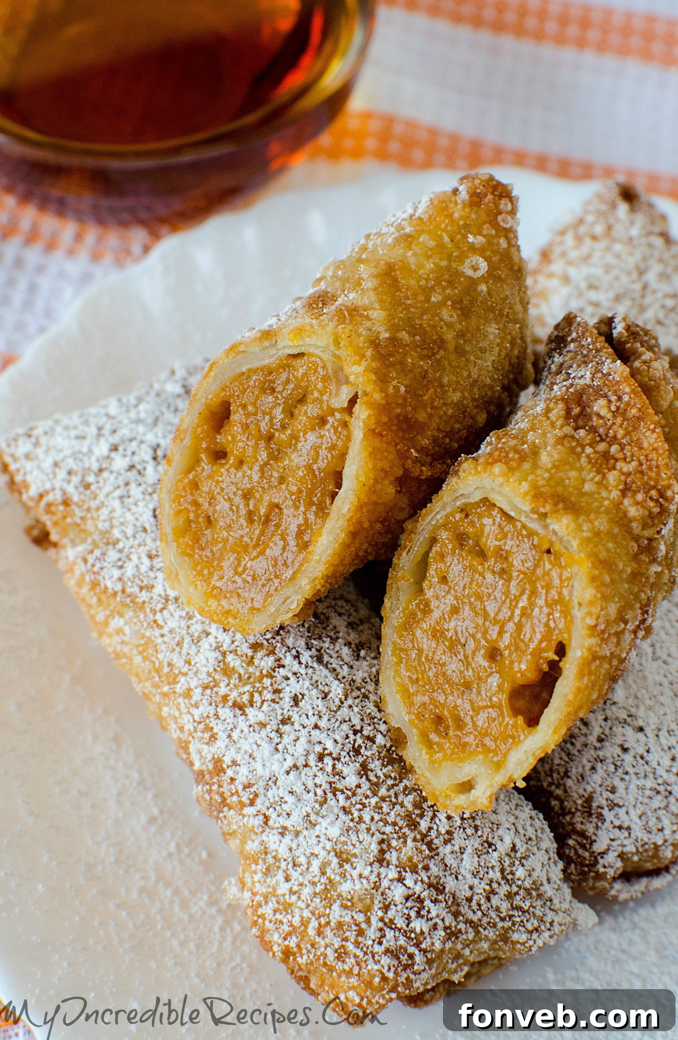 Pumpkin Pie Egg Rolls served with a delicious maple syrup dipping sauce