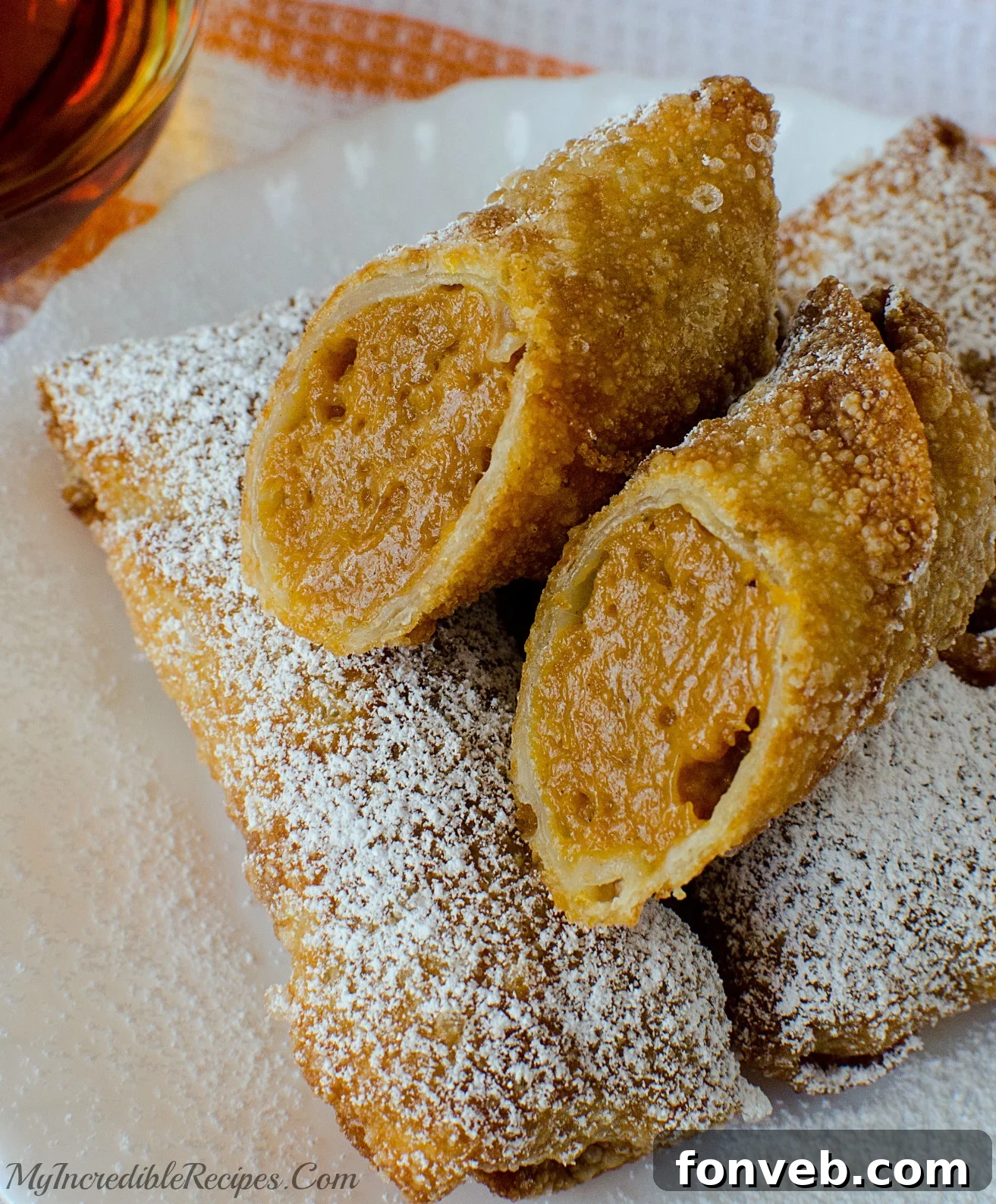Pumpkin Pie Egg Rolls served hot with melting vanilla ice cream and caramel drizzle