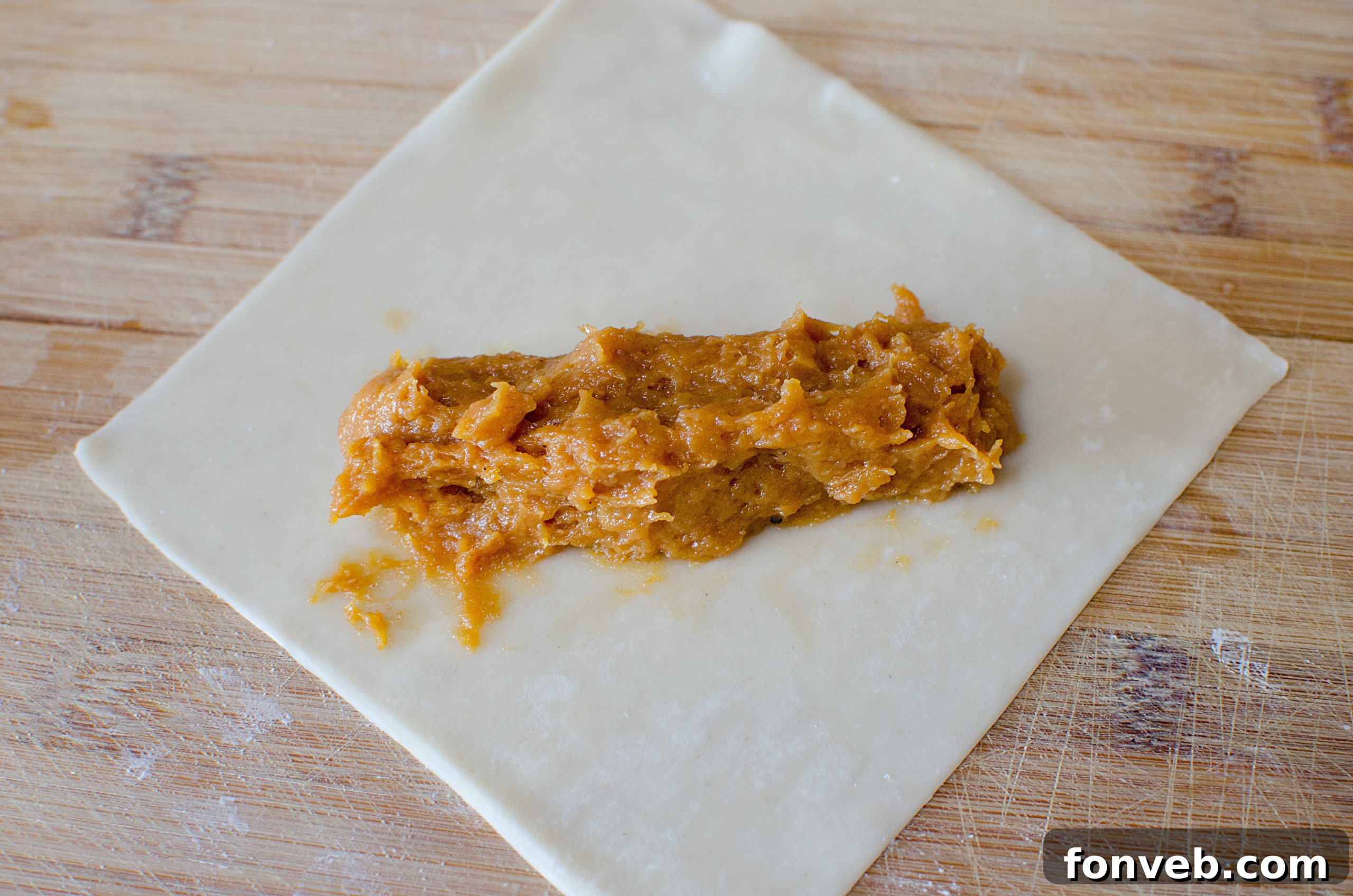Close-up of freshly fried Pumpkin Egg Rolls, showcasing their golden-brown and crispy texture